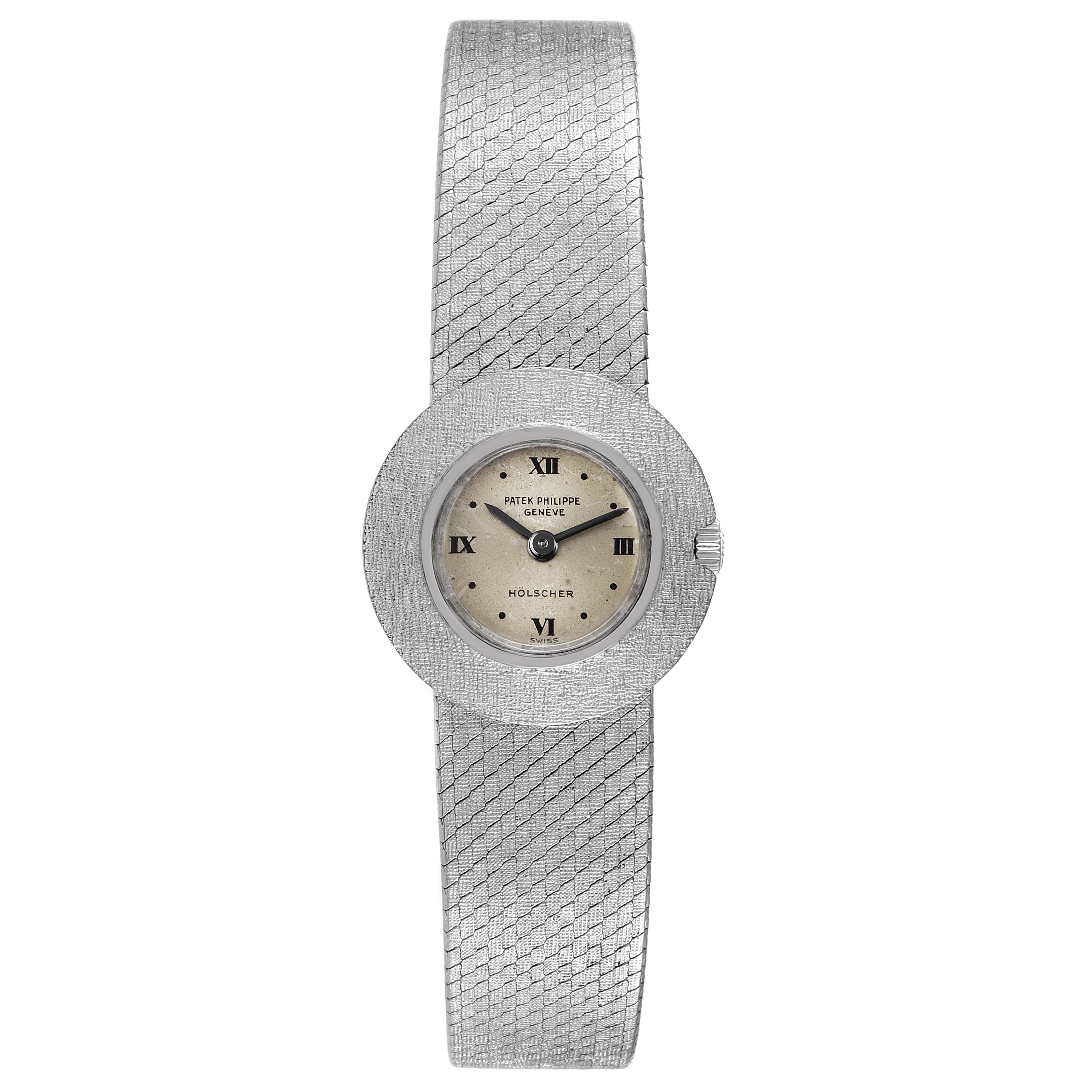 The image shows a frontal view of a Patek Philippe Calatrava 3344 Women's White Gold Silver Dial 3344 Women's White Gold Silver Dial watch, featuring its face, bezel, and integrated bracelet.