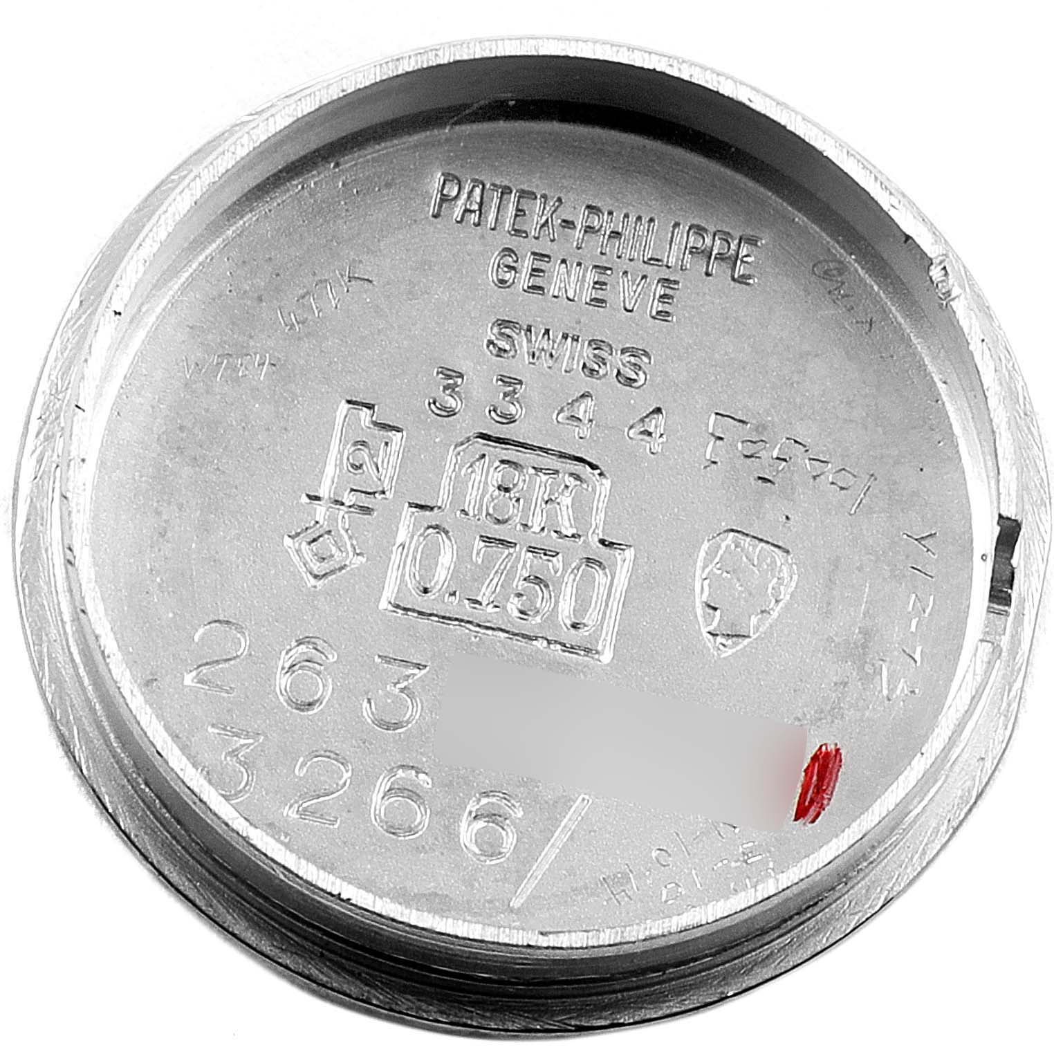 The image shows the interior case back of a Patek Philippe Calatrava 3344 Women's White Gold Silver Dial 3344 Women's White Gold Silver Dial watch, featuring engravings and hallmarks.