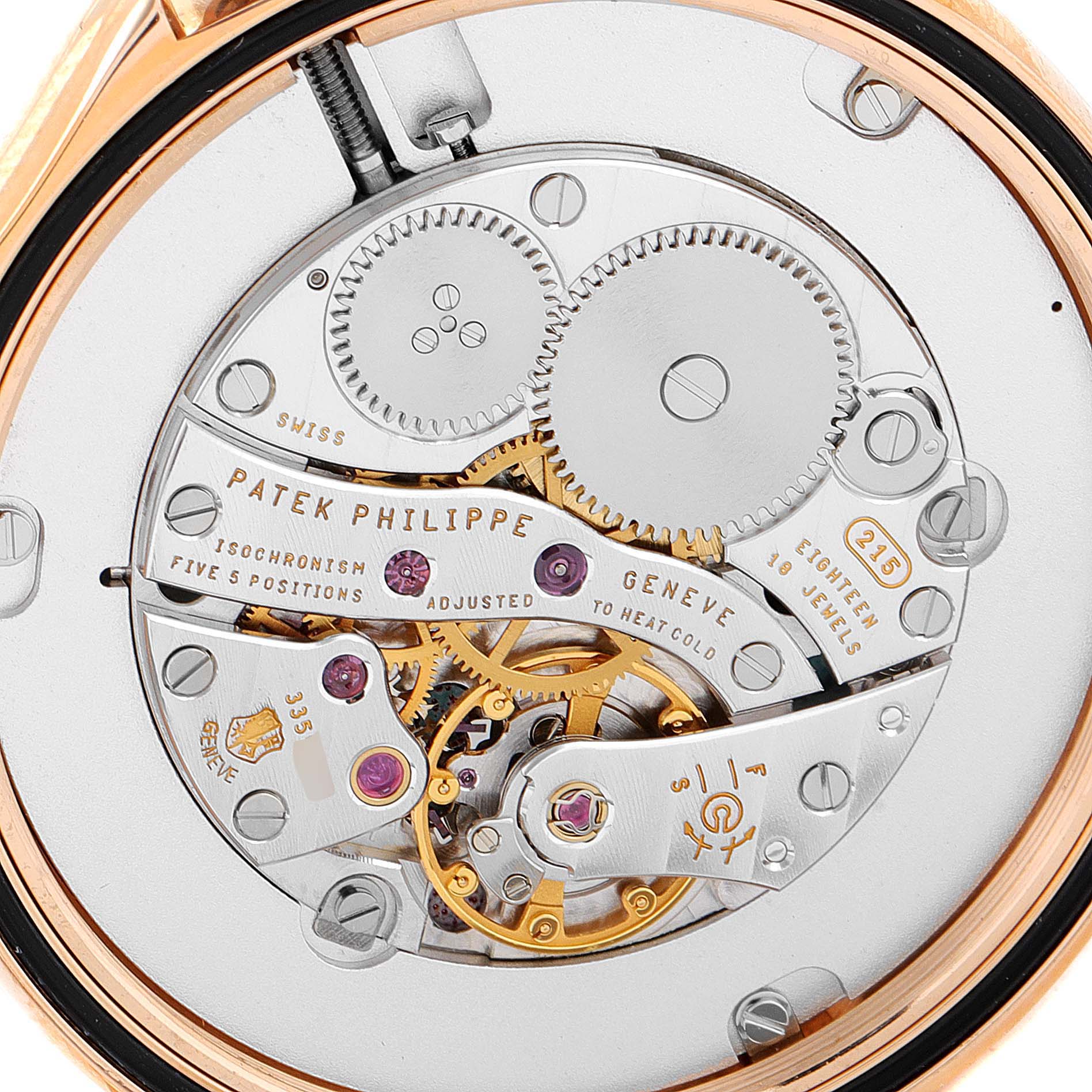 The image shows the intricate inner mechanism of the Patek Philippe Calatrava 5115R Men's Rose Gold White Dial 5115R Men's Rose Gold White Dial watch from a close-up, rear angle.