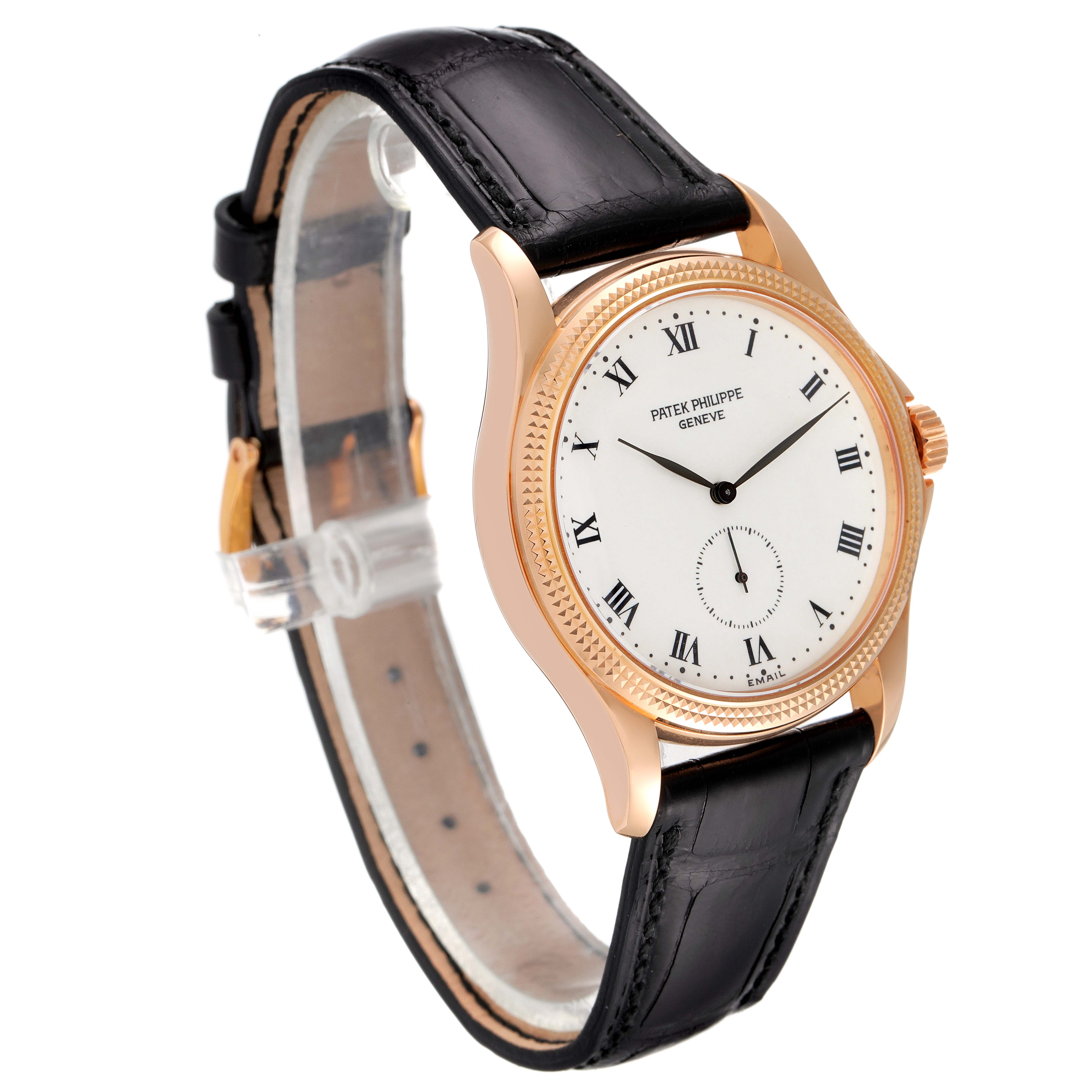 This image shows a Patek Philippe Calatrava 5115R Men's Rose Gold White Dial 5115R Men's Rose Gold White Dial watch at an oblique angle featuring its face, strap, and buckle.
