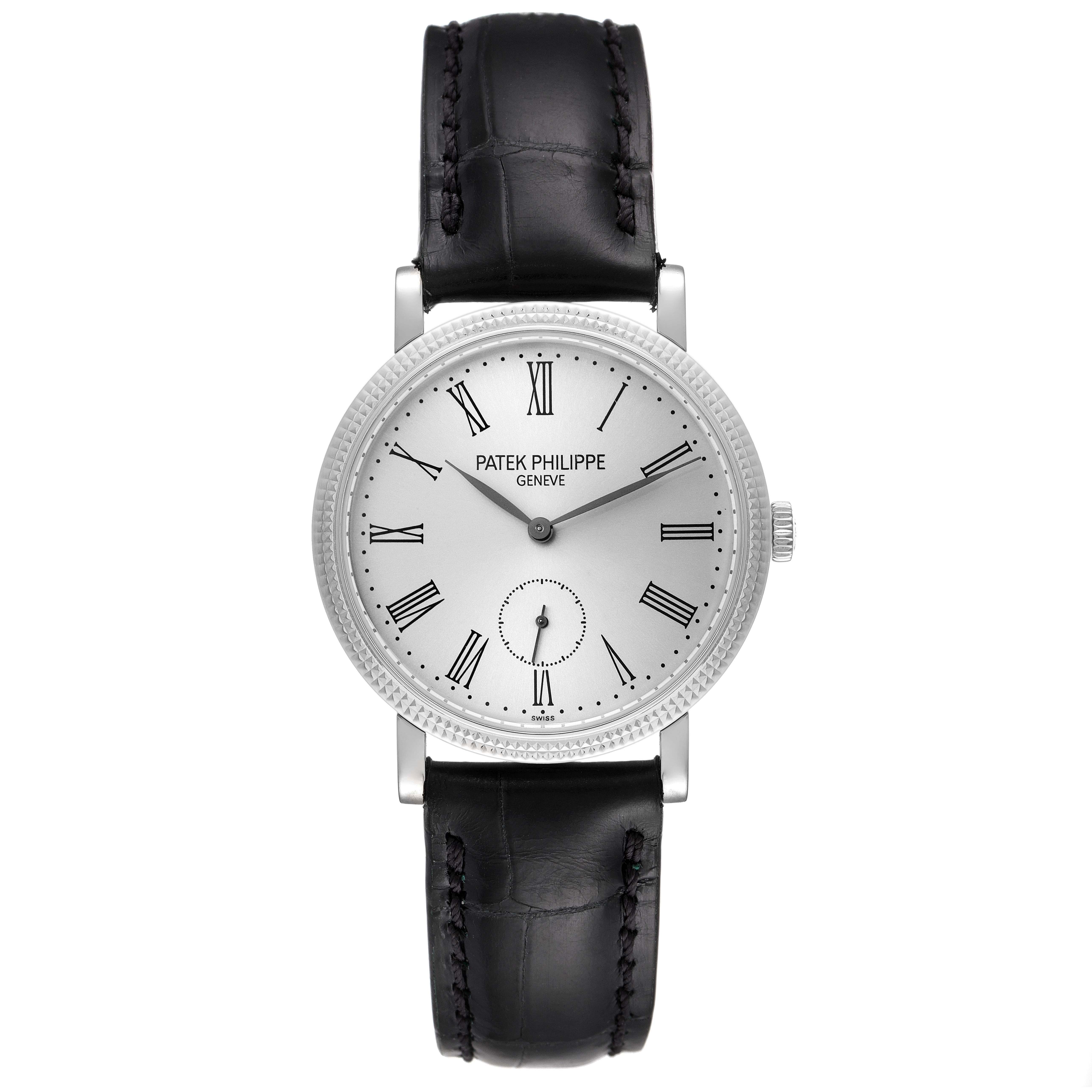 The image shows a front view of a Patek Philippe Calatrava 7119G Men's White Gold Silver Dial 7119G Men's White Gold Silver Dial watch, showcasing its face, dial, hands, and black leather strap.