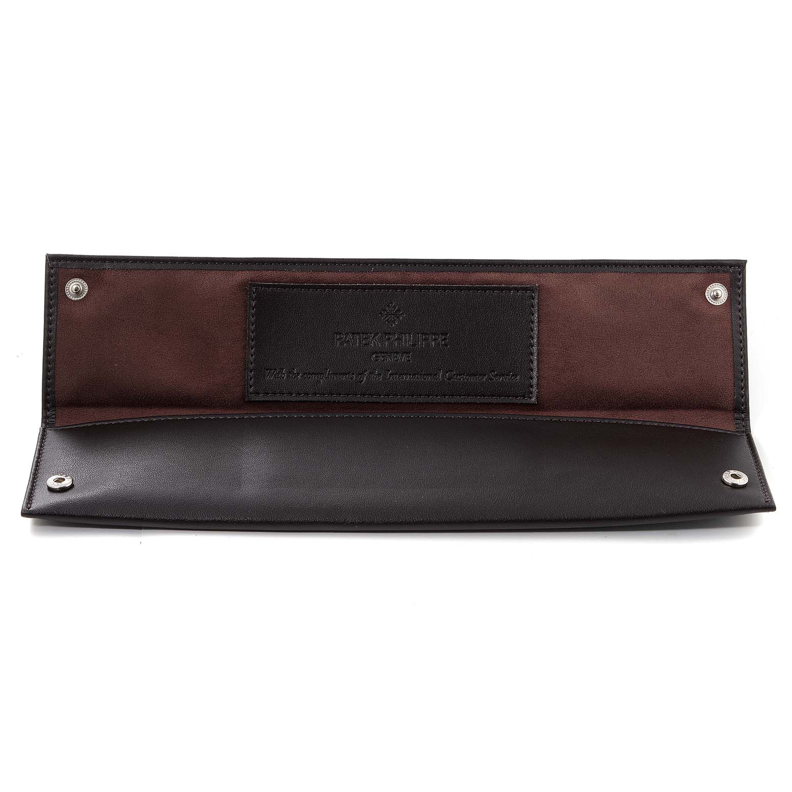 The image shows an open Patek Philippe Calatrava 7119G Men's White Gold Silver Dial 7119G Men's White Gold Silver Dial watch case or pouch, displaying its brown and black interior with snap closures.