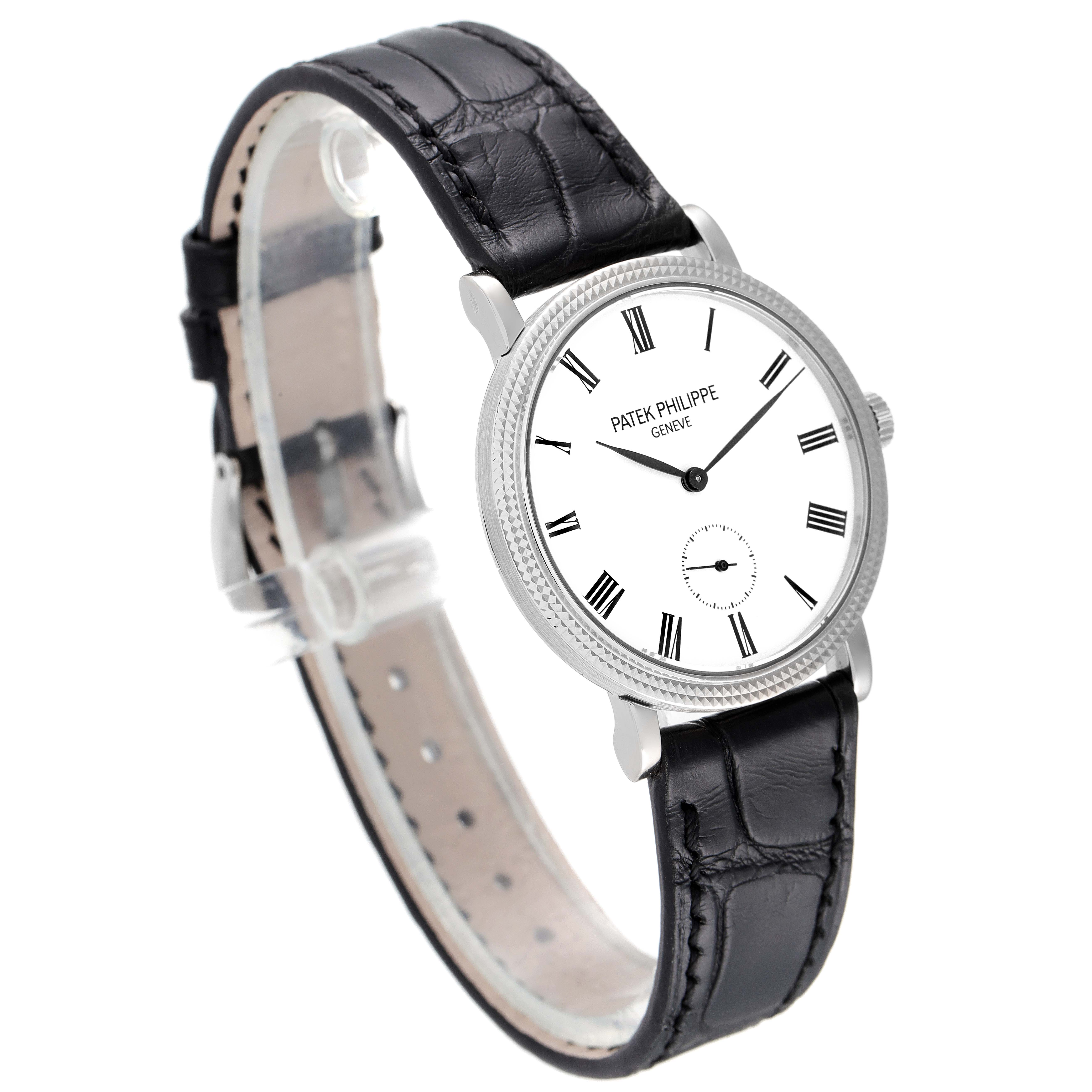The Patek Philippe Calatrava 7119G Women's White Gold White Dial 7119G Women's White Gold White Dial watch is shown at a slight angle, highlighting its white dial, black leather strap, and Roman numeral markers.