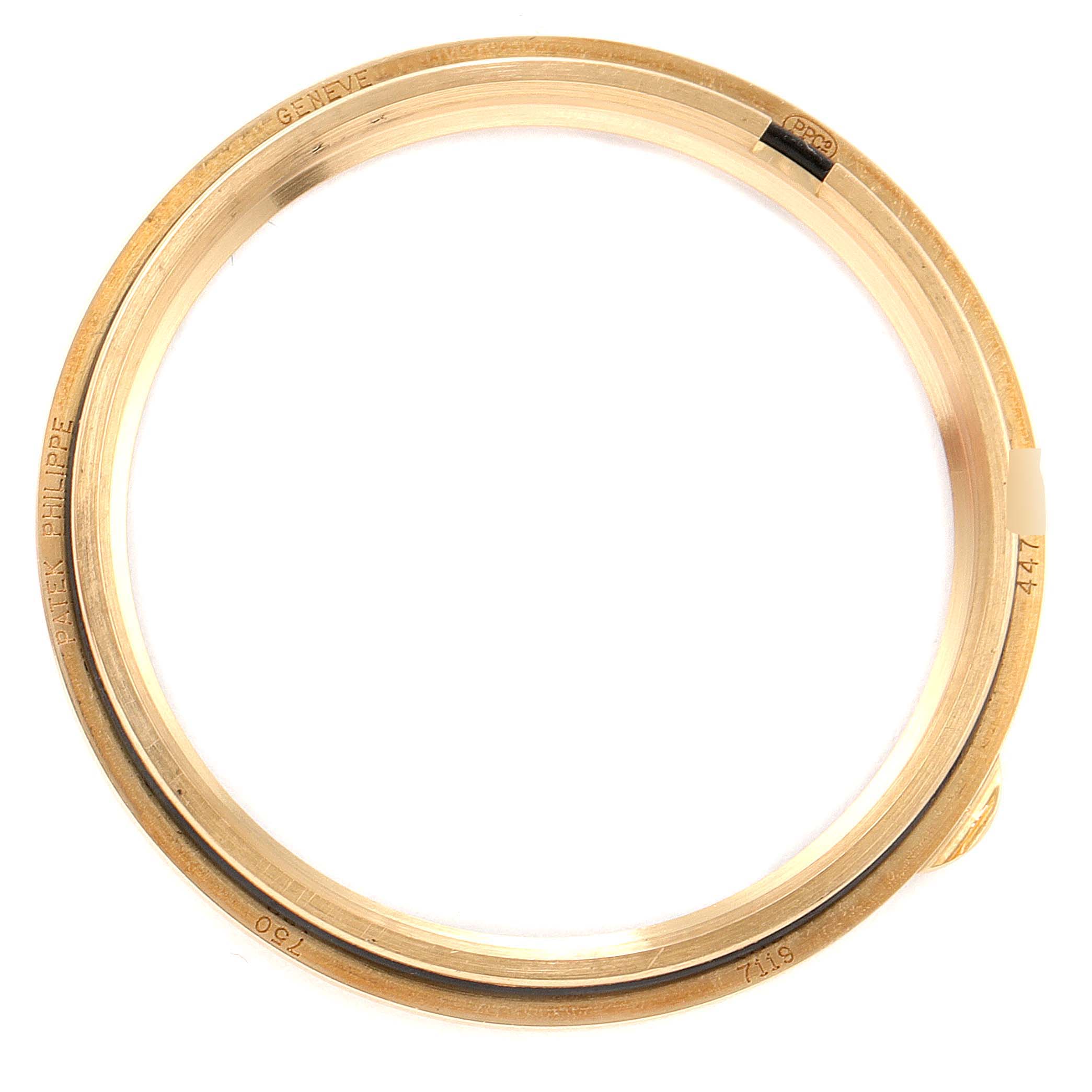 This image shows the gold bezel of a Patek Philippe Calatrava 7119J Women's Yellow Gold White Dial 7119J Women's Yellow Gold White Dial watch, viewed from above.