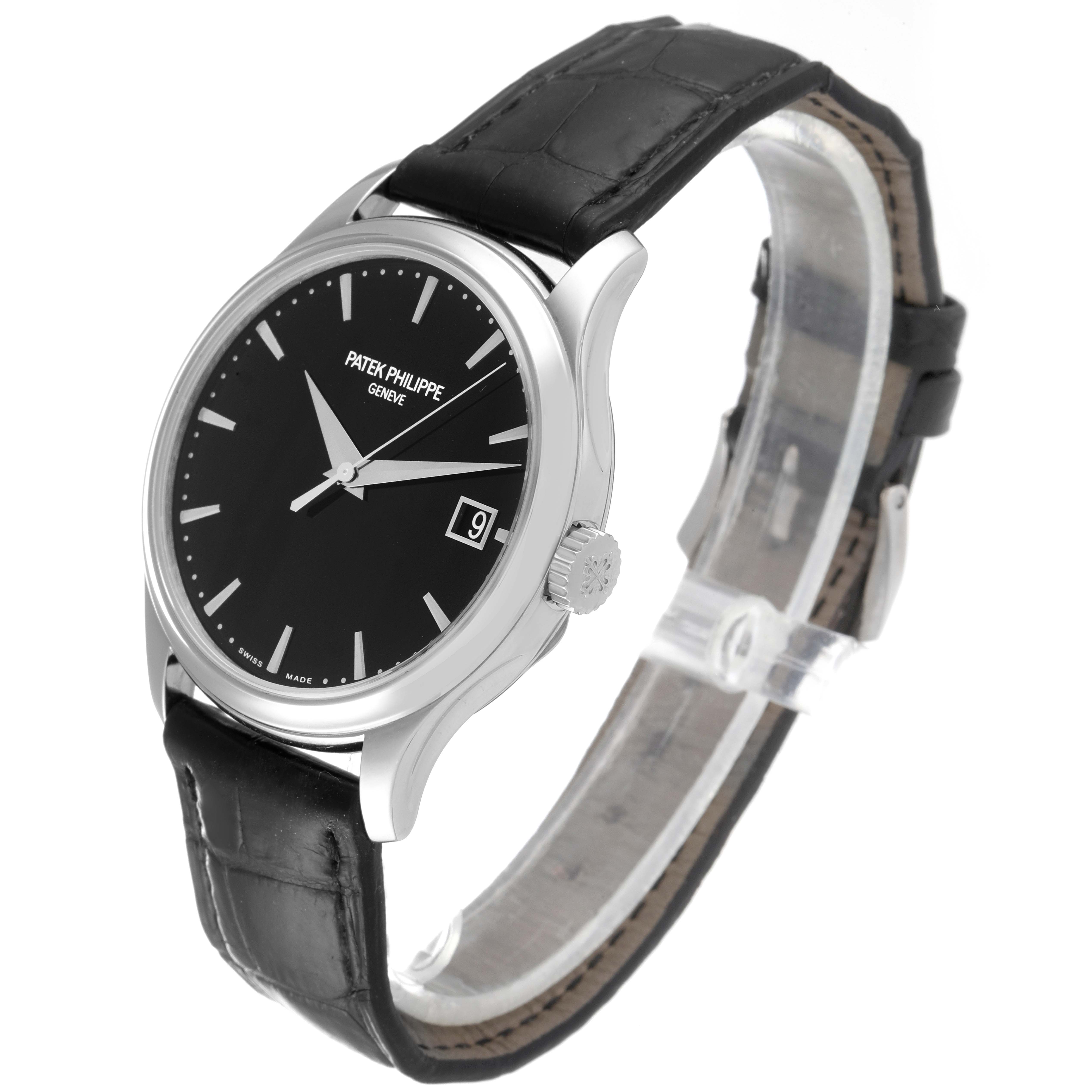 The image shows a side angle view of a Patek Philippe Calatrava 5227G Men's White Gold Black Dial 5227G Men's White Gold Black Dial watch, highlighting its black dial, date display, and black leather strap.