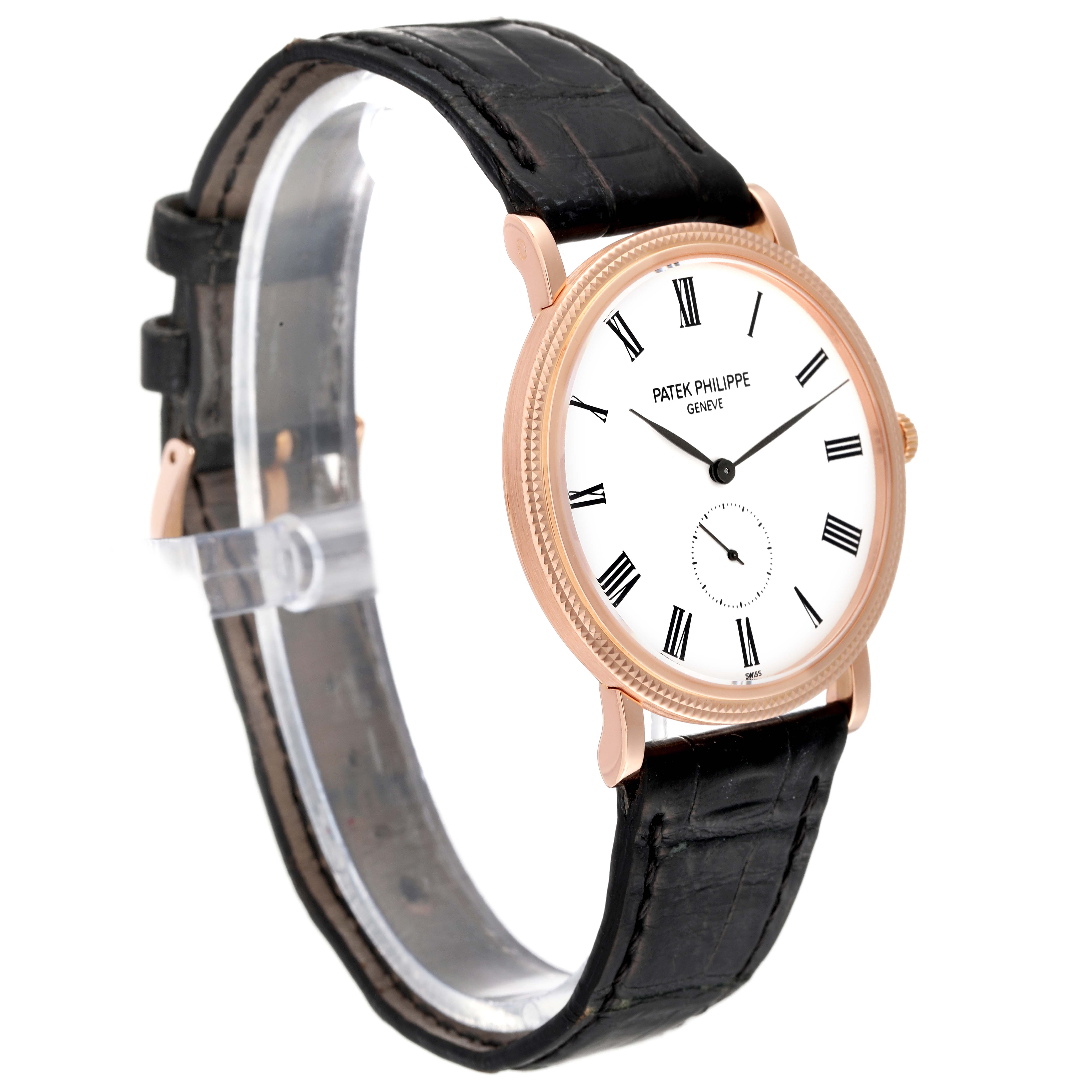 The image shows a side angle of the Patek Philippe Calatrava 5119R Men
s Rose Gold White Dial 5119R Men
s Rose Gold White Dial watch, displaying its black leather strap and gold case.