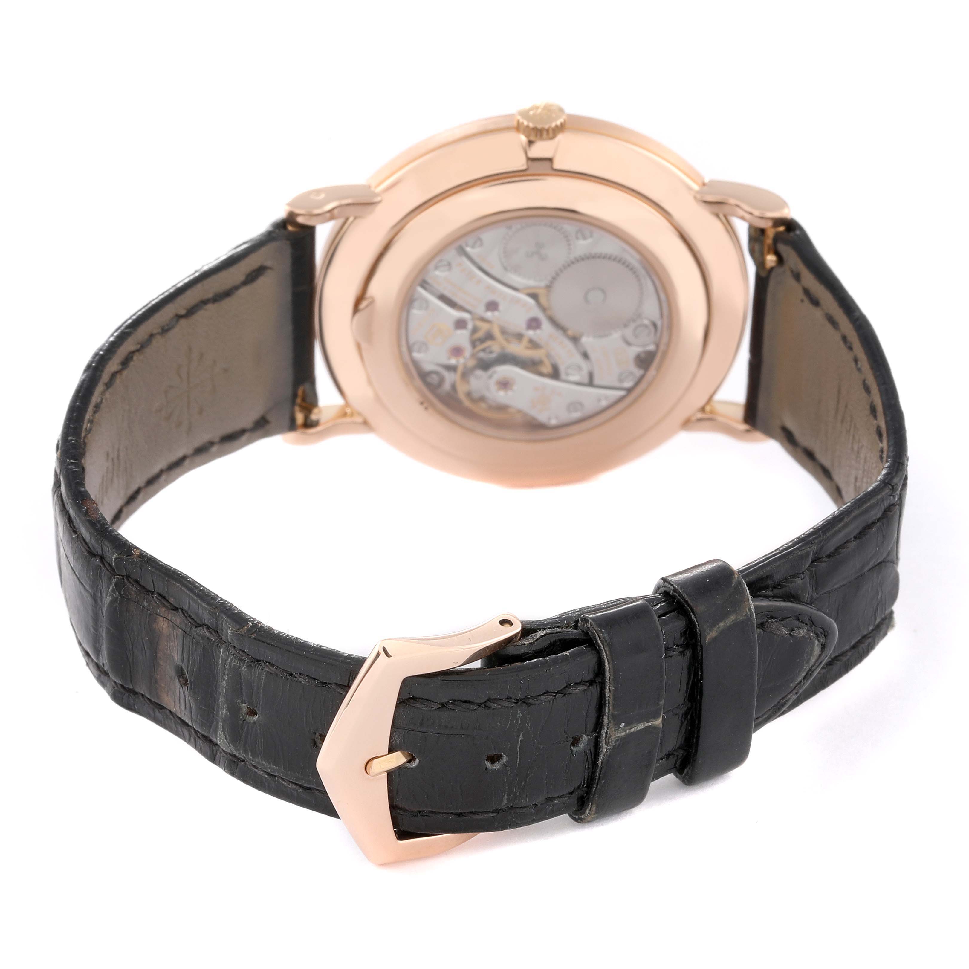 The image shows the back view of a Patek Philippe Calatrava 5119R Men
s Rose Gold White Dial 5119R Men
s Rose Gold White Dial watch, highlighting the strap and mechanical movement.