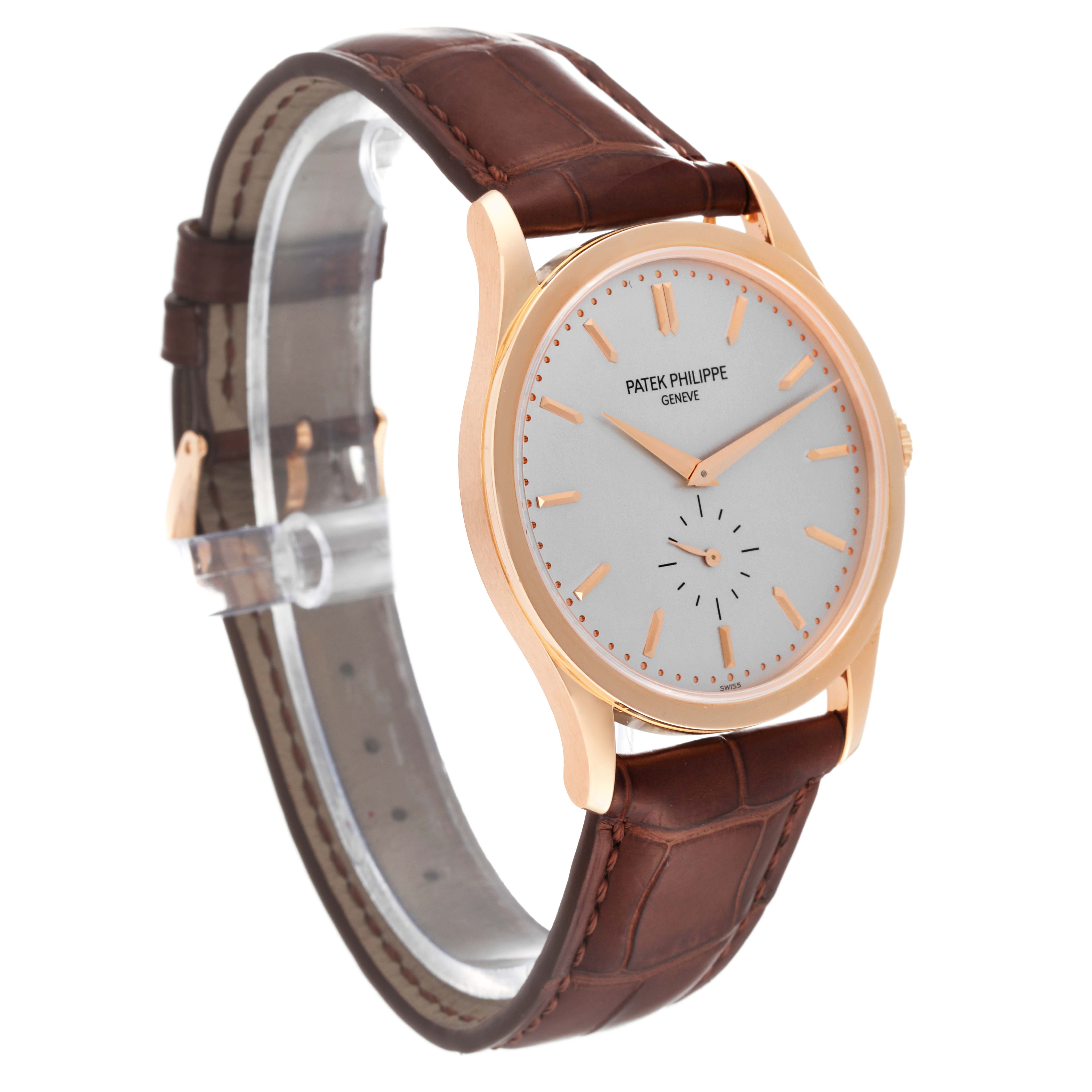 The Patek Philippe Calatrava 5196R Men
s Rose Gold Silver Dial 5196R Men
s Rose Gold Silver Dial model watch is shown at a slight angle, displaying the face, crown, and brown leather strap.
