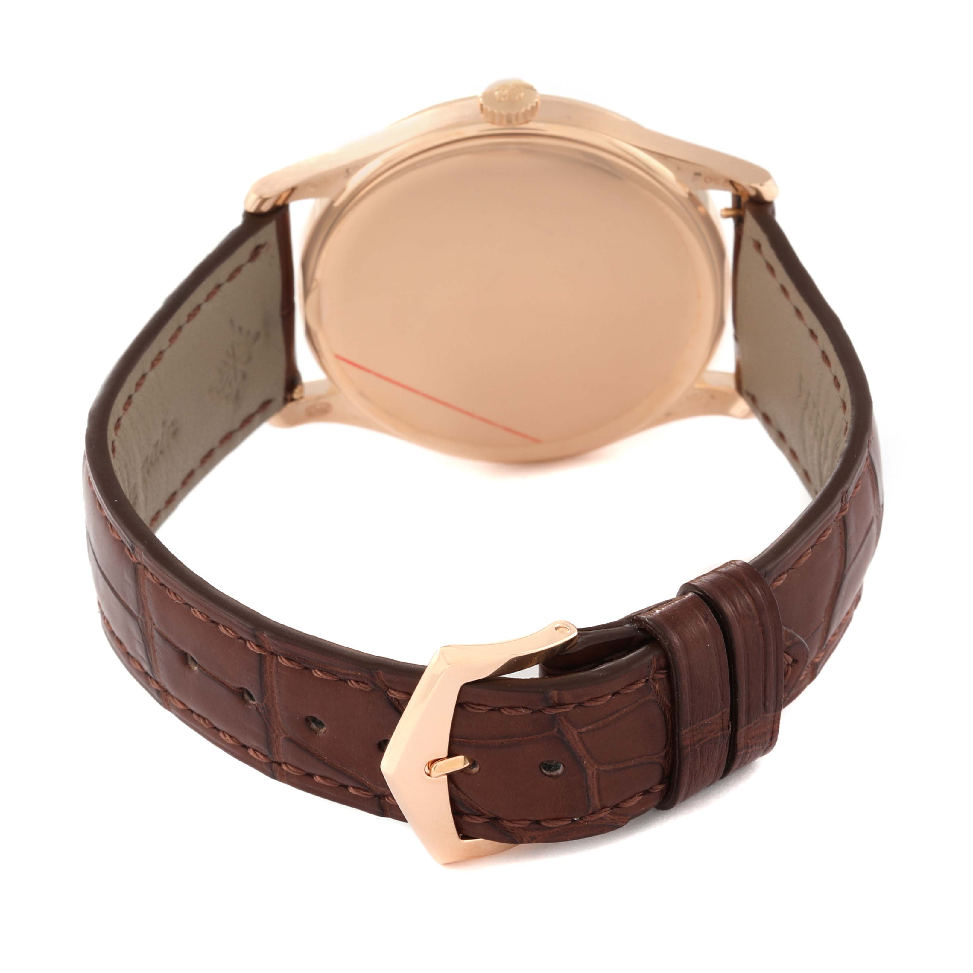 This image shows the rear view of a Patek Philippe Calatrava 5196R Men
s Rose Gold Silver Dial 5196R Men
s Rose Gold Silver Dial watch, highlighting the back case, crown, and brown leather strap with buckle.