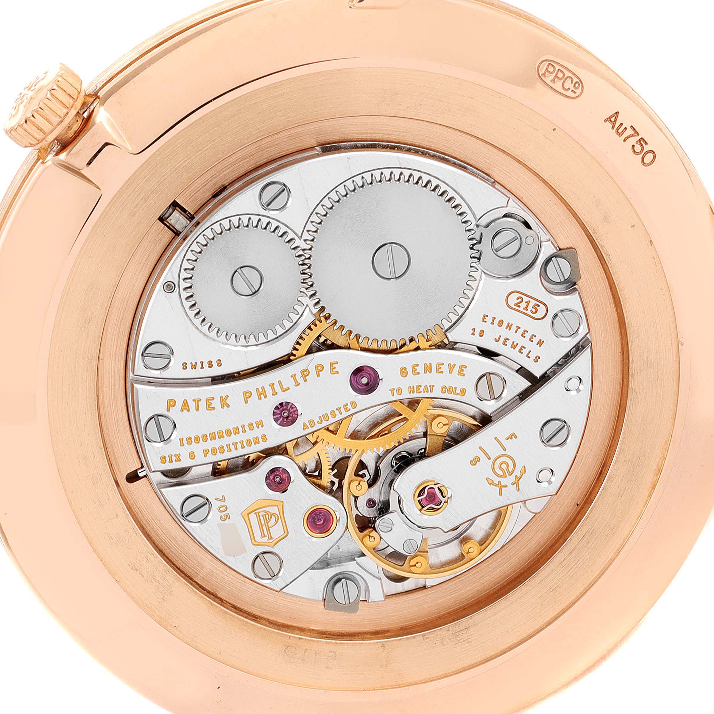 The image shows the intricate movement and inner workings of a Patek Philippe Calatrava 5119R Men's Rose Gold White Dial 5119R Men's Rose Gold White Dial watch.