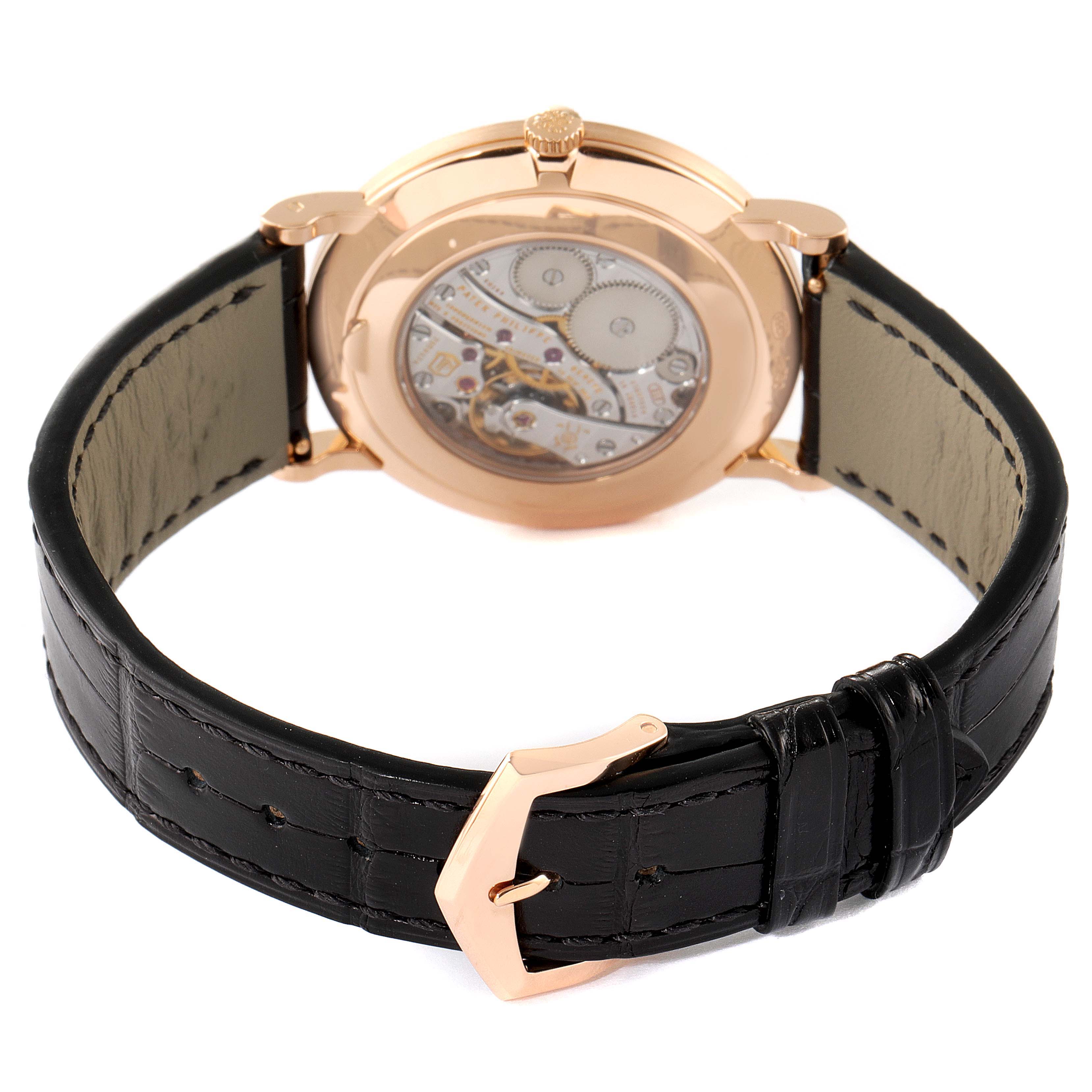 This image shows the rear view of a Patek Philippe Calatrava 5119R Men's Rose Gold White Dial 5119R Men's Rose Gold White Dial watch, highlighting its caseback and black leather strap with a rose gold buckle.