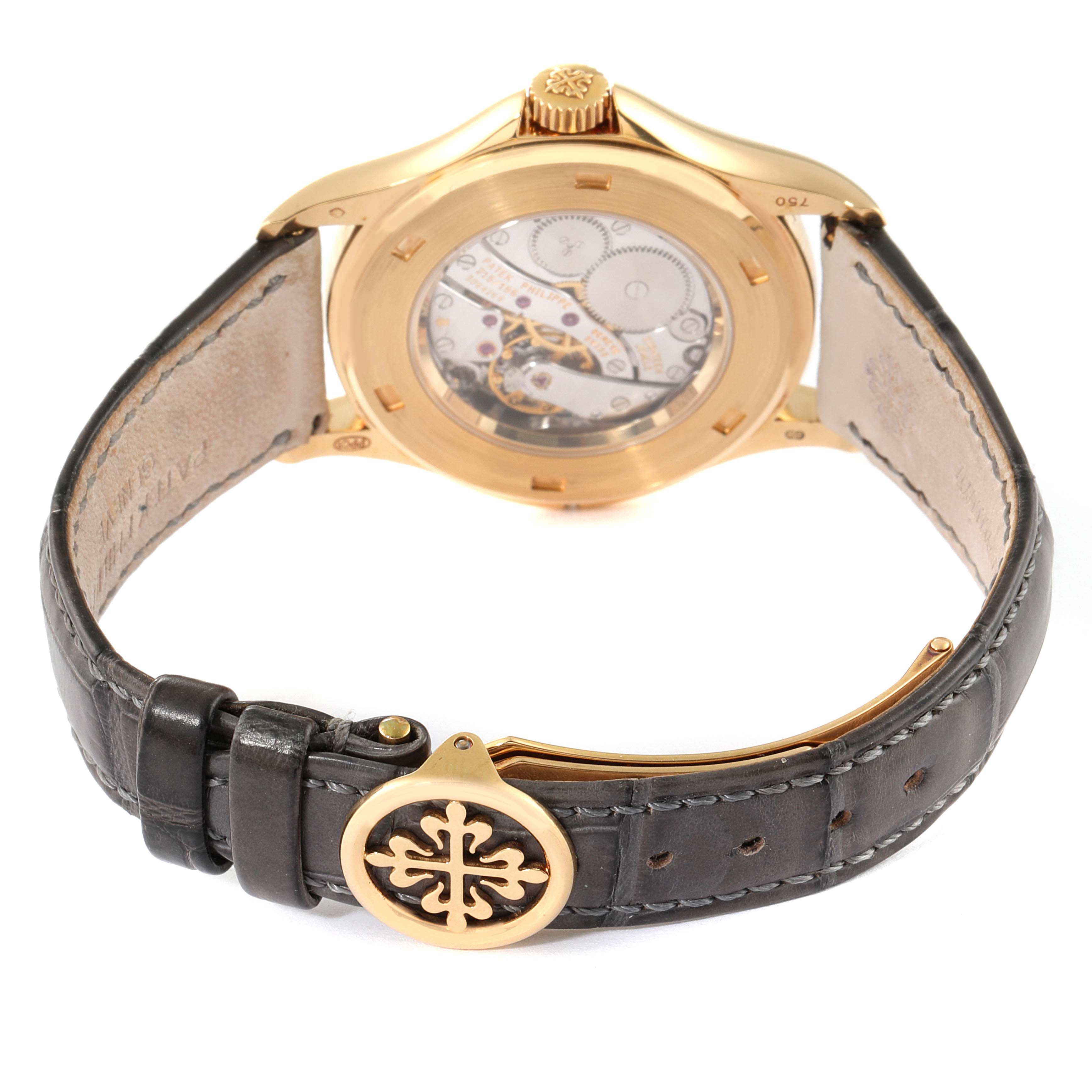 The image shows the back view of a Patek Philippe Calatrava 5134J Men's Yellow Gold White Dial 5134J Men's Yellow Gold White Dial watch, highlighting its transparent case back and leather strap with a buckle.