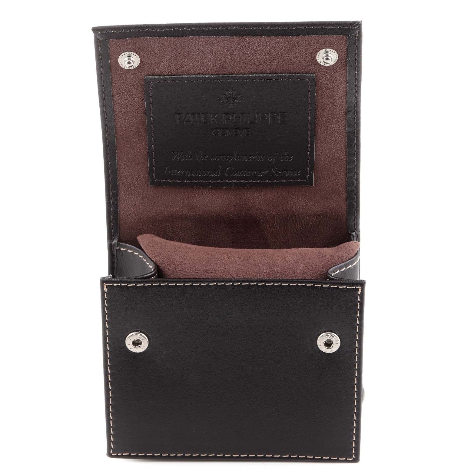 This image shows the open case for a Patek Philippe Calatrava 6000G Men
s White Gold Grey Dial 6000G Men
s White Gold Grey Dial watch, viewed from the front.