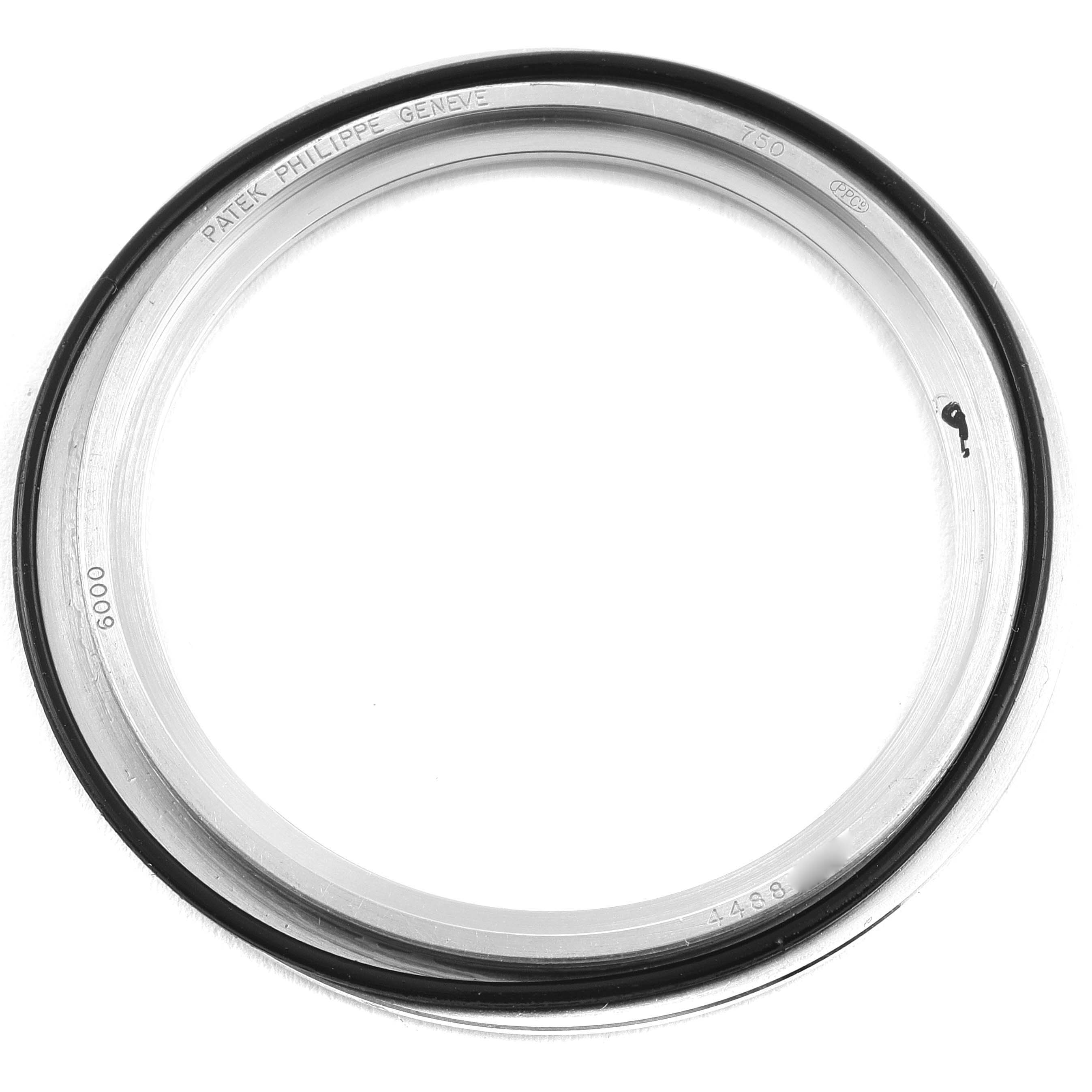 The image shows a close-up of the bezel for a Patek Philippe Calatrava 6000G Men
s White Gold Grey Dial 6000G Men
s White Gold Grey Dial watch.