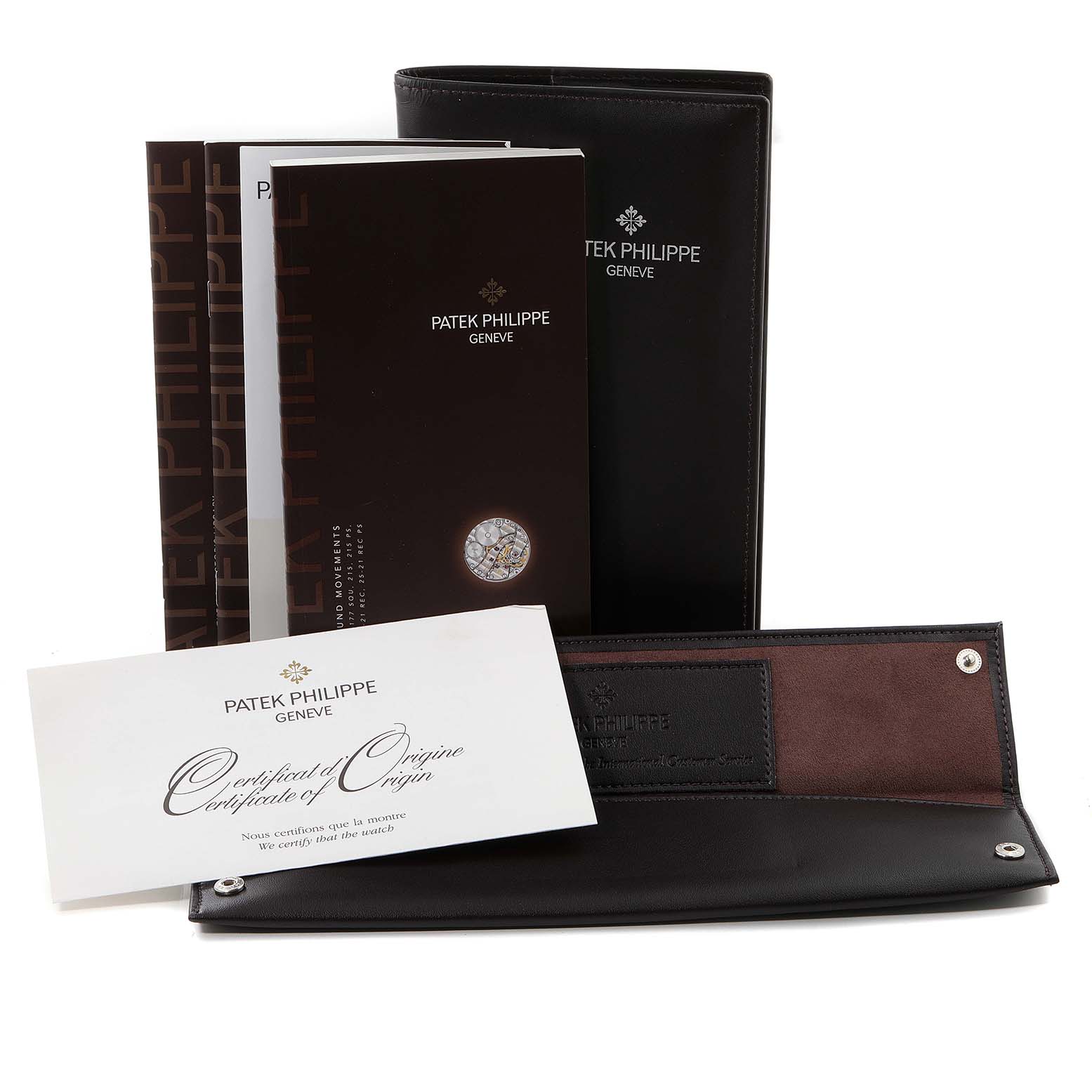 The image shows the Patek Philippe Calatrava 5119J Men
s Yellow Gold White Dial 5119J Men
s Yellow Gold White Dial model
s documentation, including booklets, a certificate, and a leather case, from a front angle.