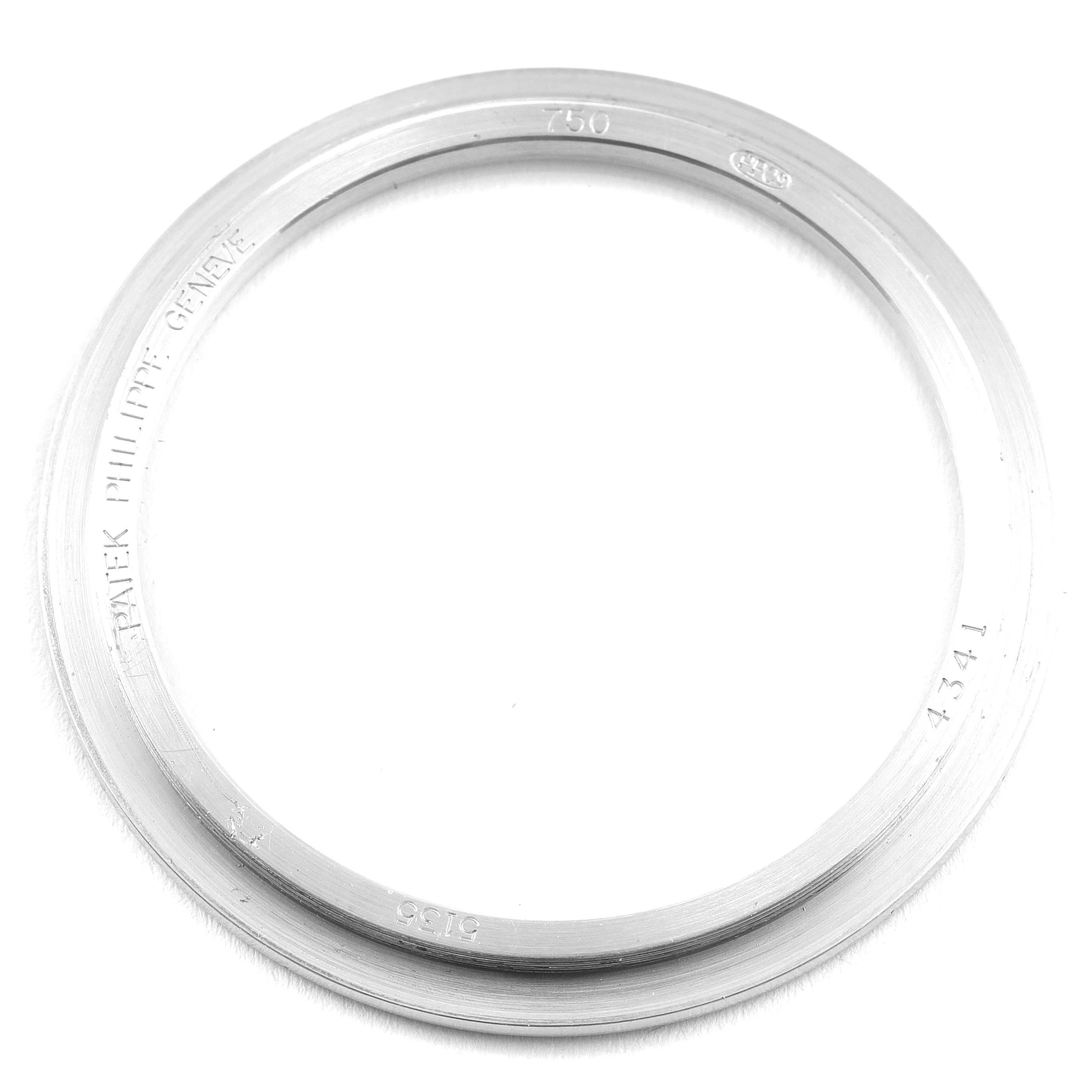 This image shows the bezel ring from a Patek Philippe Gondolo 5135G Men's White Gold Silver Dial 5135G Men's White Gold Silver Dial model watch, viewed from above.