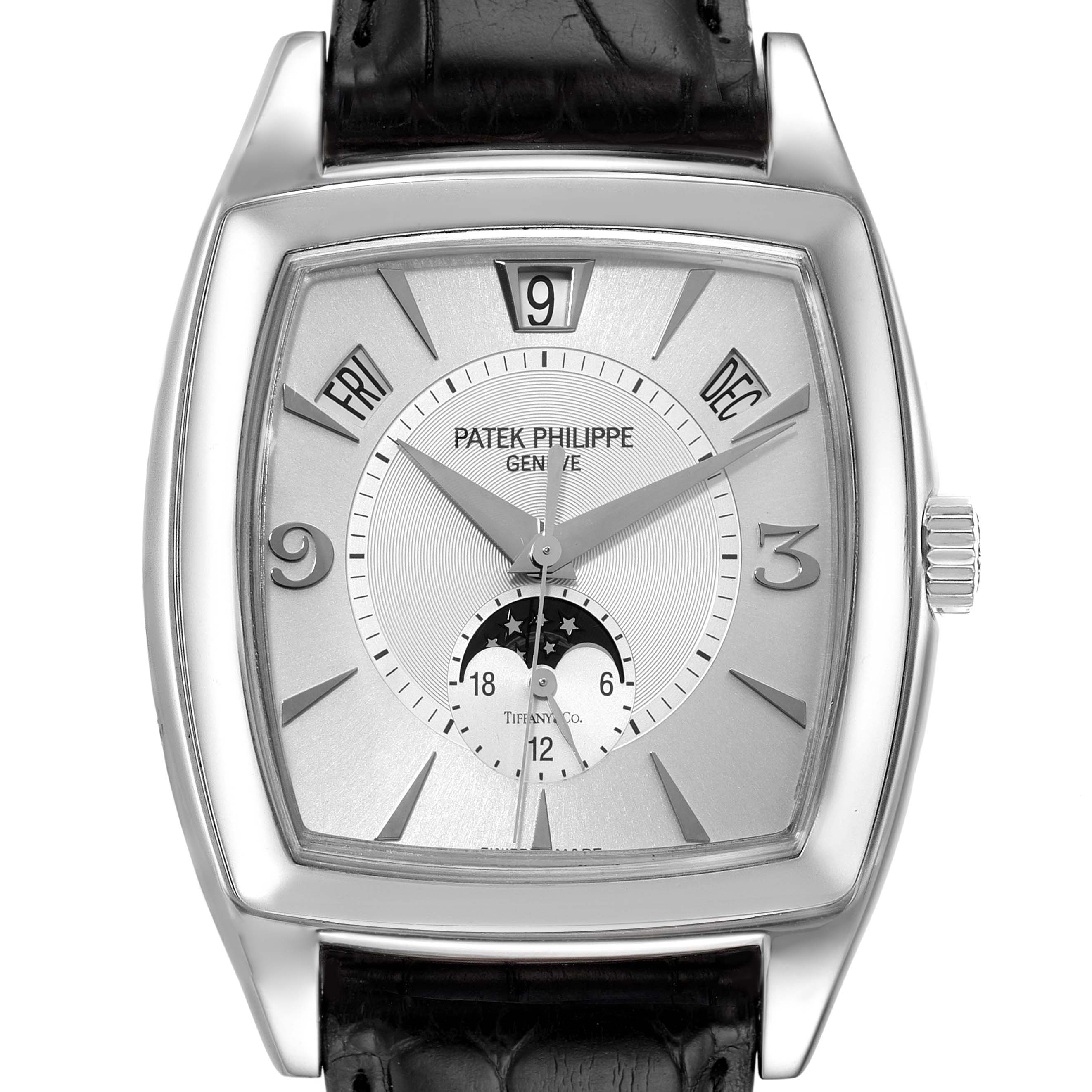 The Patek Philippe Gondolo 5135G Men's White Gold Silver Dial 5135G Men's White Gold Silver Dial watch is shown from a front angle, displaying its dial, hands, date windows, and leather strap.