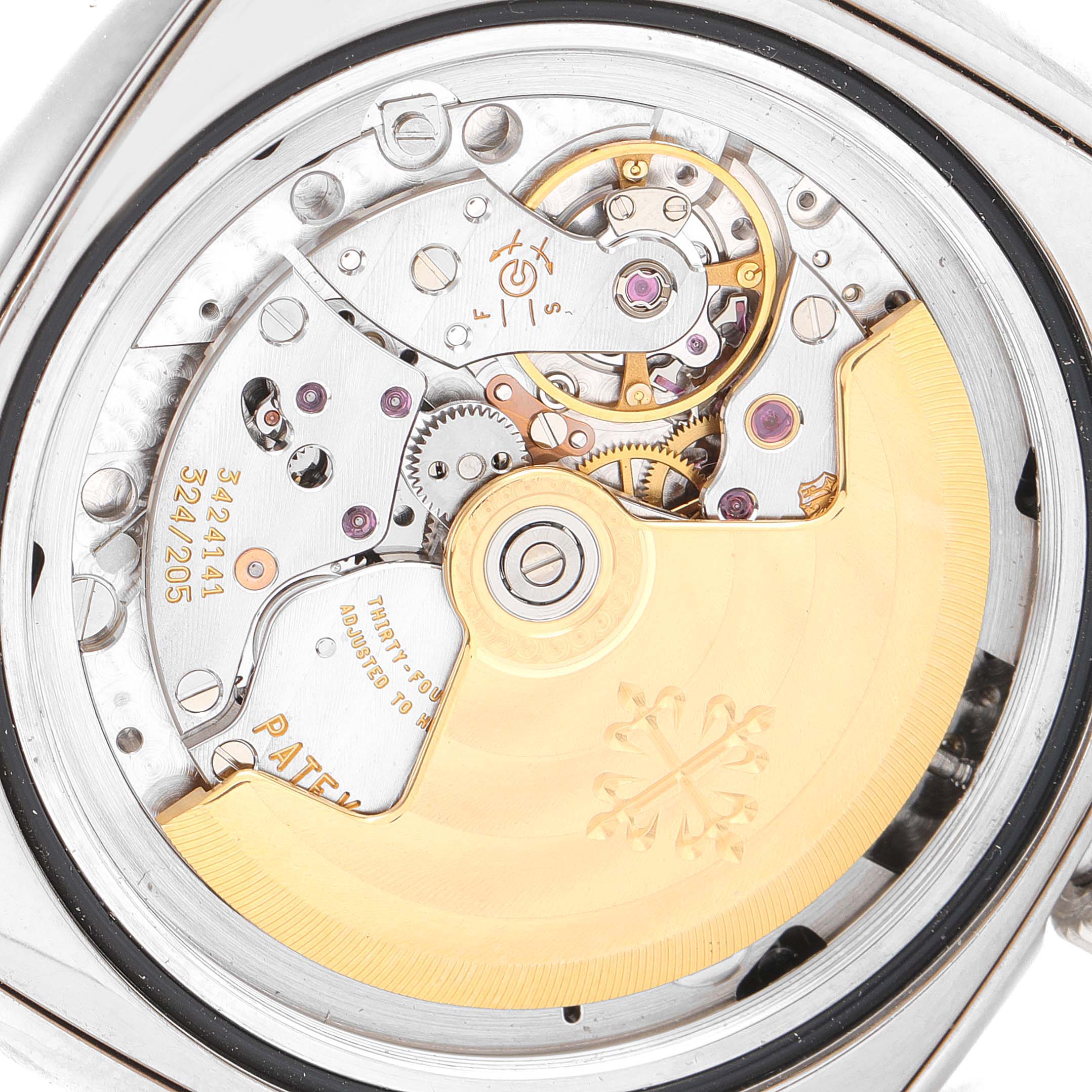 This image shows the intricate movement mechanism and rotor of the Patek Philippe Gondolo 5135G Men's White Gold Silver Dial 5135G Men's White Gold Silver Dial watch from a rear angle.
