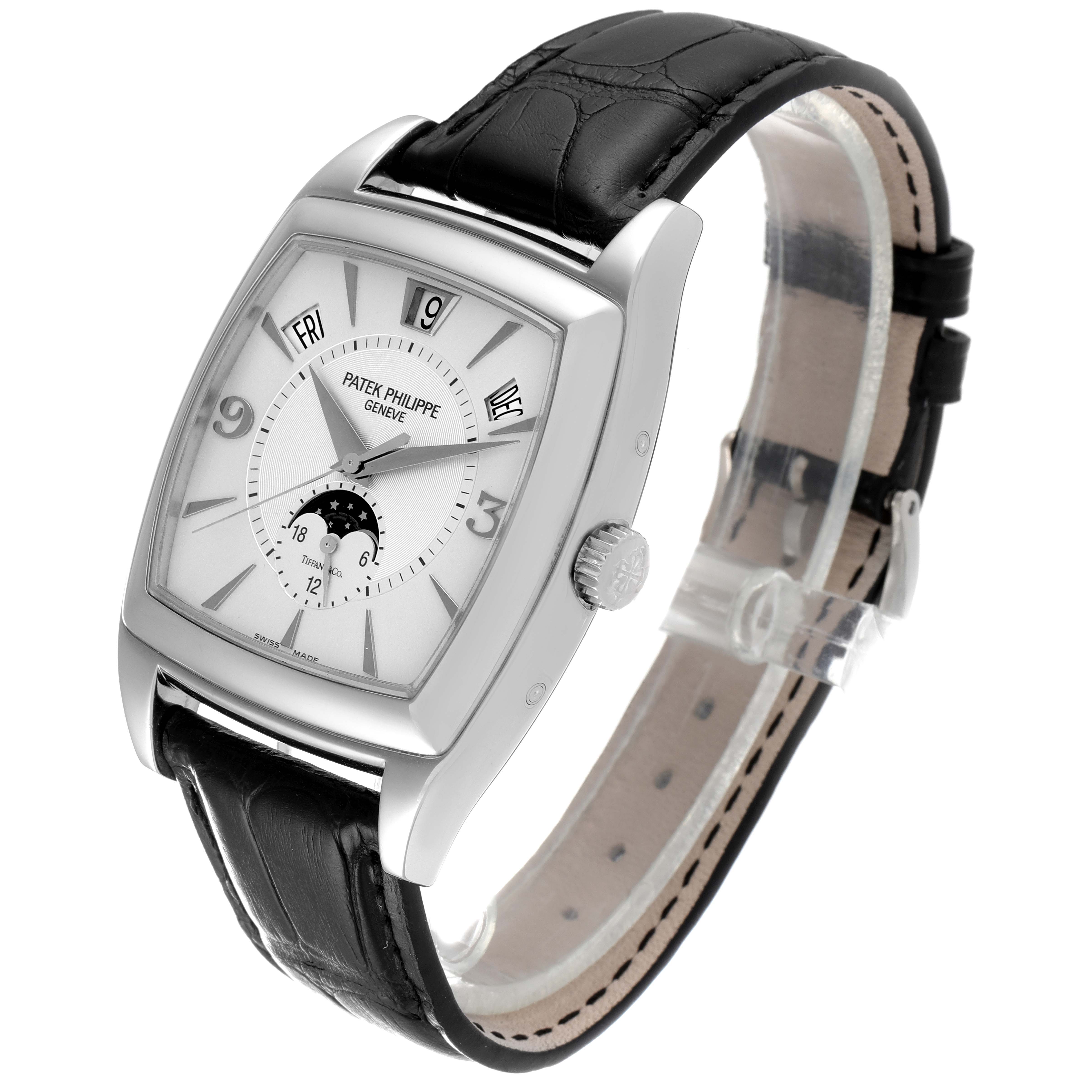 The Patek Philippe Gondolo 5135G Men's White Gold Silver Dial 5135G Men's White Gold Silver Dial watch is displayed at a three-quarter angle, showcasing its face, case, strap, and crown.