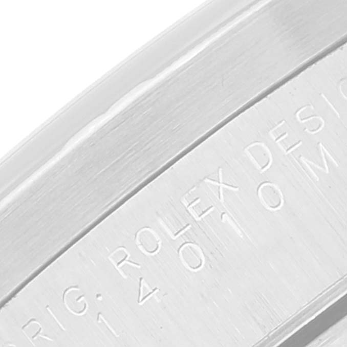 This close-up image shows the engraved edge of a Rolex Air-King 14010 Men's Stainless Steel Black Dial 14010 Men's Stainless Steel Black Dial watch case, featuring the model and design inscription.