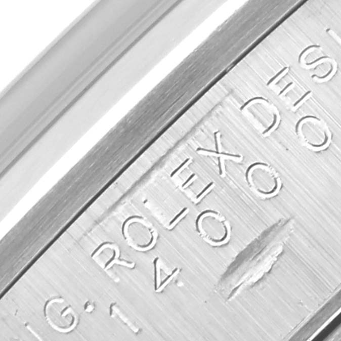 The image shows an angled close-up of the engraving on the inner case or clasp of a Rolex Air-King 14000 Men's Stainless Steel Blue Dial 14000 Men's Stainless Steel Blue Dial watch.