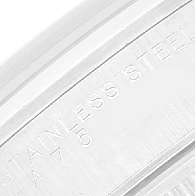 This close-up image shows part of the stainless steel casing on a Rolex Air-King 14000 Men's Stainless Steel Silver Dial 14000 Men's Stainless Steel Silver Dial watch.