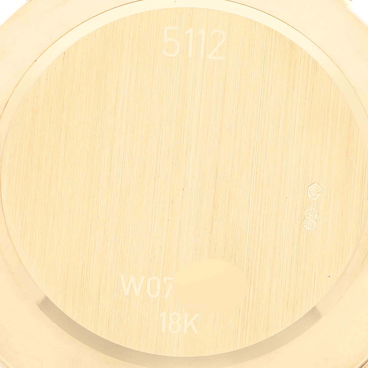 This image shows the case back of a Rolex Cellini 5112/8 Men's Yellow Gold Champagne Dial 5112/8 Men's Yellow Gold Champagne Dial model, highlighting the model number and 18K gold stamp.