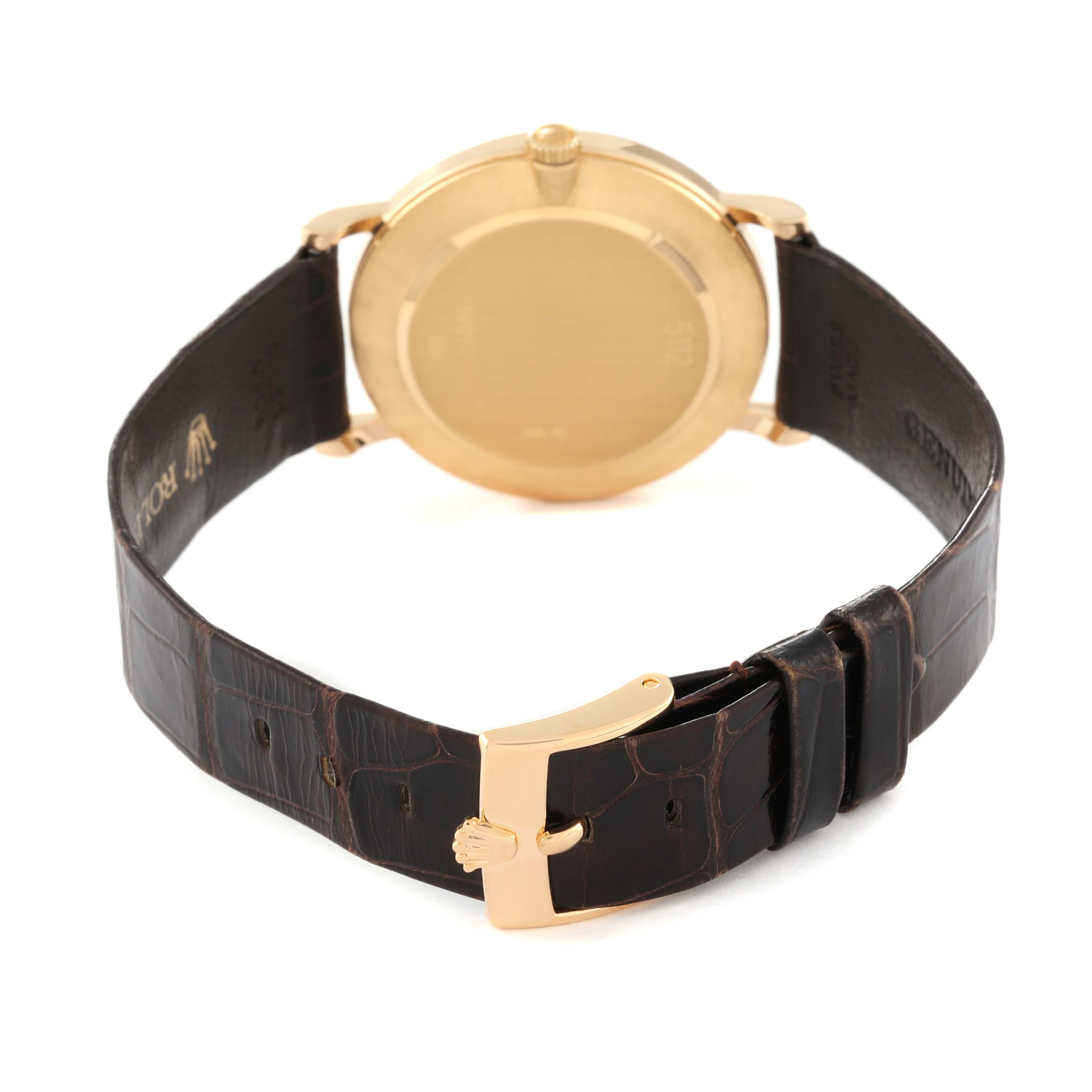 The image shows the back of a Rolex Cellini 5112/8 Men's Yellow Gold Champagne Dial 5112/8 Men's Yellow Gold Champagne Dial watch, featuring its case, crown, leather strap, and the buckle.