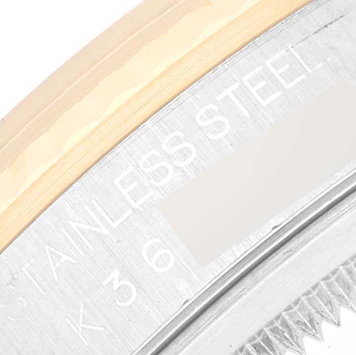 This close-up image shows the stainless steel case and part of the bezel of a Rolex Datejust 16233 Men's Steel and Gold (two tone) Champagne Dial 16233 Men's Steel and Gold (two tone) Champagne Dial watch.