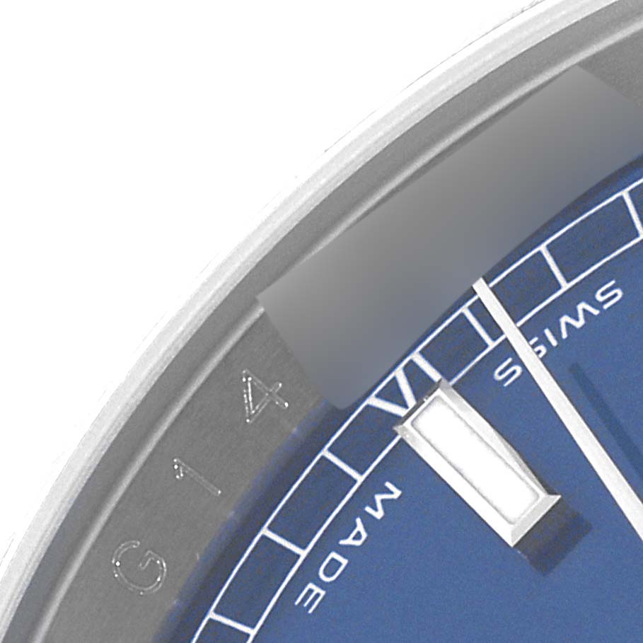 This close-up image shows part of the bezel, dial, and indices of a Rolex Datejust 116234 Men's Stainless Steel Blue Dial 116234 Men's Stainless Steel Blue Dial watch.