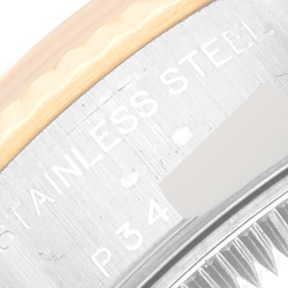 The image shows a close-up of the side engraving on a Rolex Datejust 79173 Women's Steel and Gold (two tone) Champagne Dial 79173 Women's Steel and Gold (two tone) Champagne Dial watch case, highlighting the text "STAINLESS STEEL."