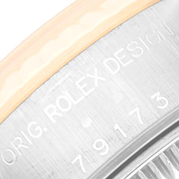 This close-up image shows the engraved back casing of the Rolex Datejust 79173 Women's Steel and Gold (two tone) Champagne Dial 79173 Women's Steel and Gold (two tone) Champagne Dial watch.