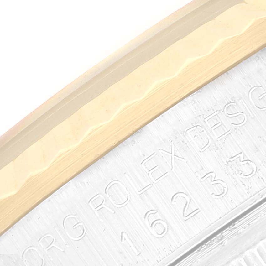 The image shows a close-up of the side of a Rolex Datejust 16233 Men's Steel and Gold (two tone) Champagne Dial 16233 Men's Steel and Gold (two tone) Champagne Dial with visible model engraving.