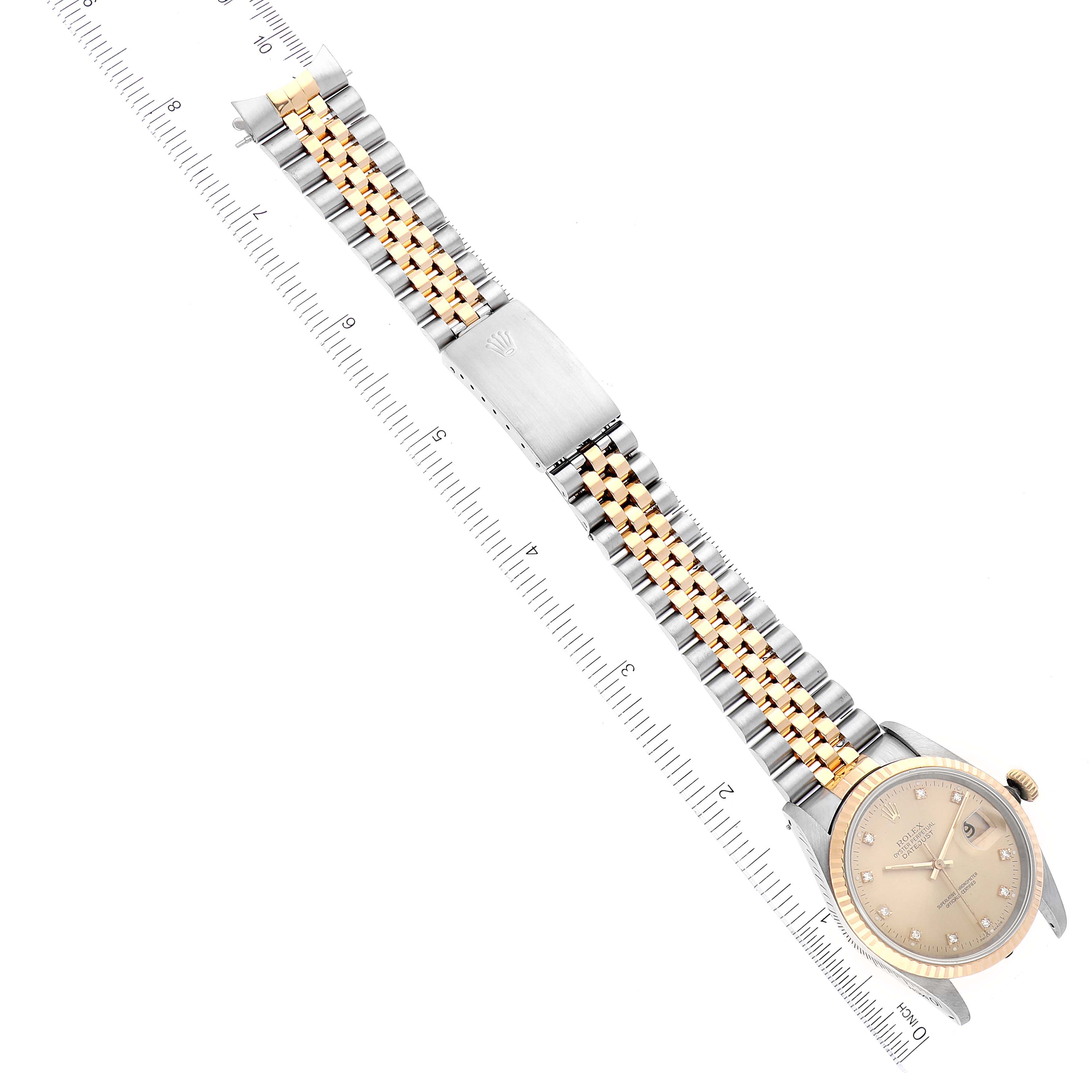 The image shows an overhead view of a Rolex Datejust 16233 Men's Steel and Gold (two tone) Champagne Dial 16233 Men's Steel and Gold (two tone) Champagne Dial watch, including its face, bracelet, and clasp.