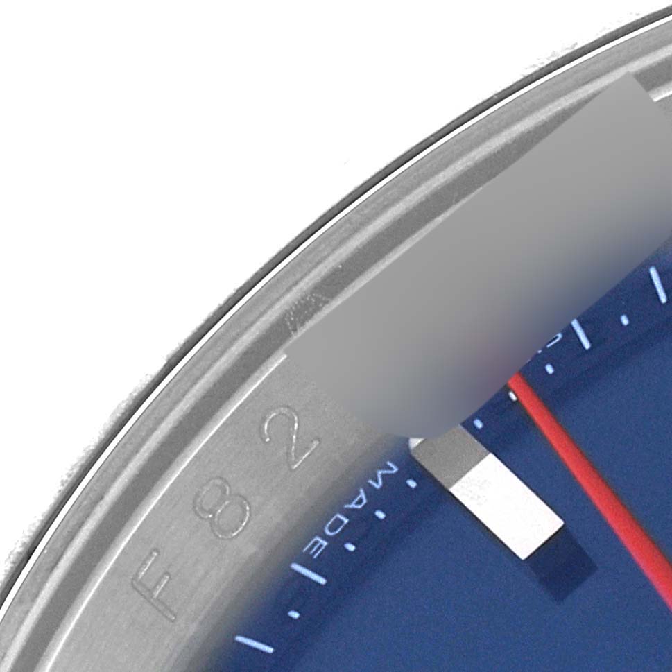 This close-up image shows the bezel
s edge and part of the dial of a Rolex Turn-o-Graph 116264 Men
s Stainless Steel Blue Dial 116264 Men
s Stainless Steel Blue Dial watch.