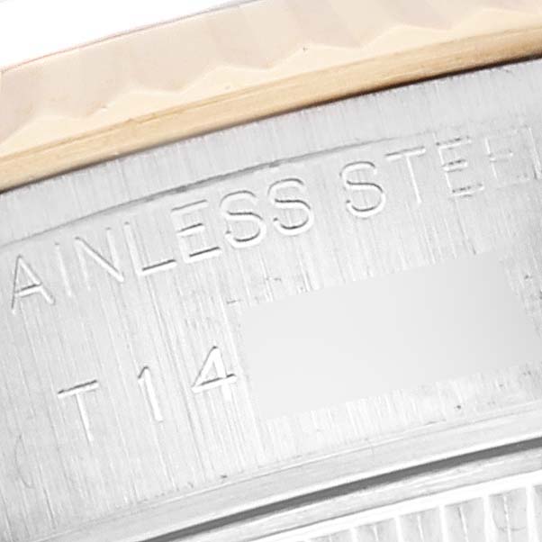 This close-up image shows the "STAINLESS STEEL" engraving on the side of a Rolex Datejust 69173 Women's Steel and Gold (two tone) White Dial 69173 Women's Steel and Gold (two tone) White Dial watch case.