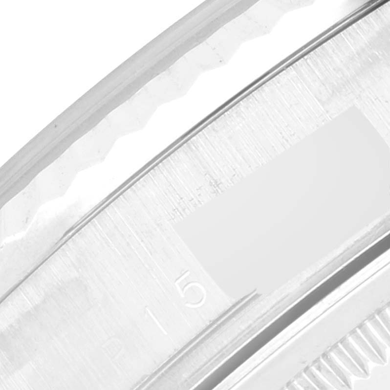 The image shows a close-up of the bezel and part of the case of a Rolex President 118239 Men's White Gold Silver Dial 118239 Men's White Gold Silver Dial model watch.