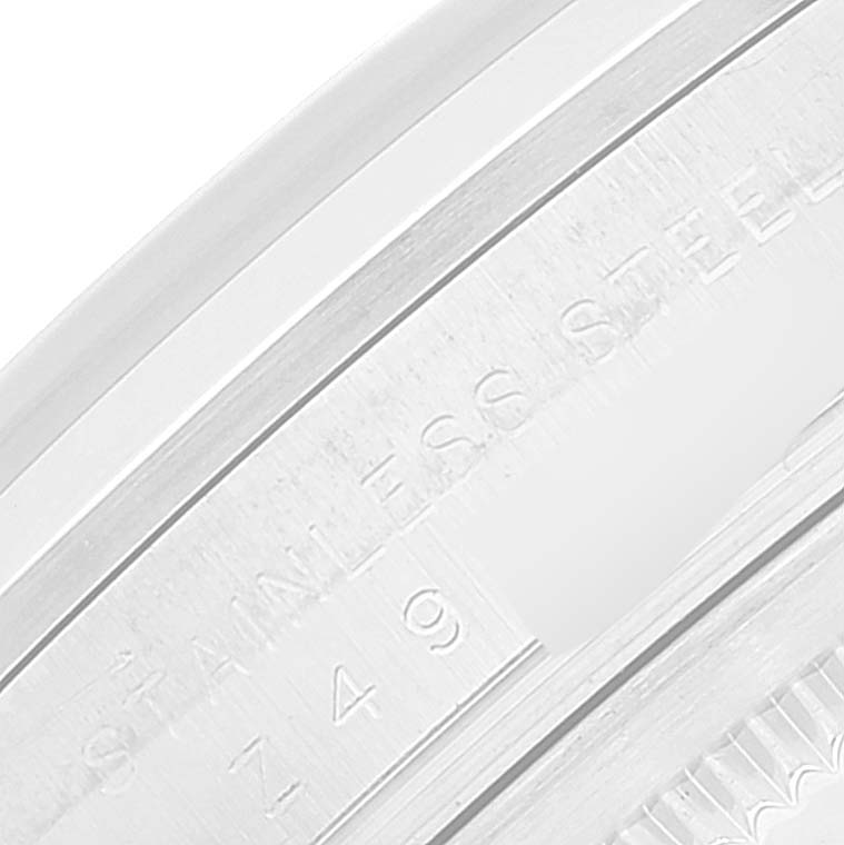 This is a close-up image showing the edge and engraving on the stainless steel case of a Rolex Explorer 114270 Men
s Stainless Steel Black Dial 114270 Men
s Stainless Steel Black Dial model watch.