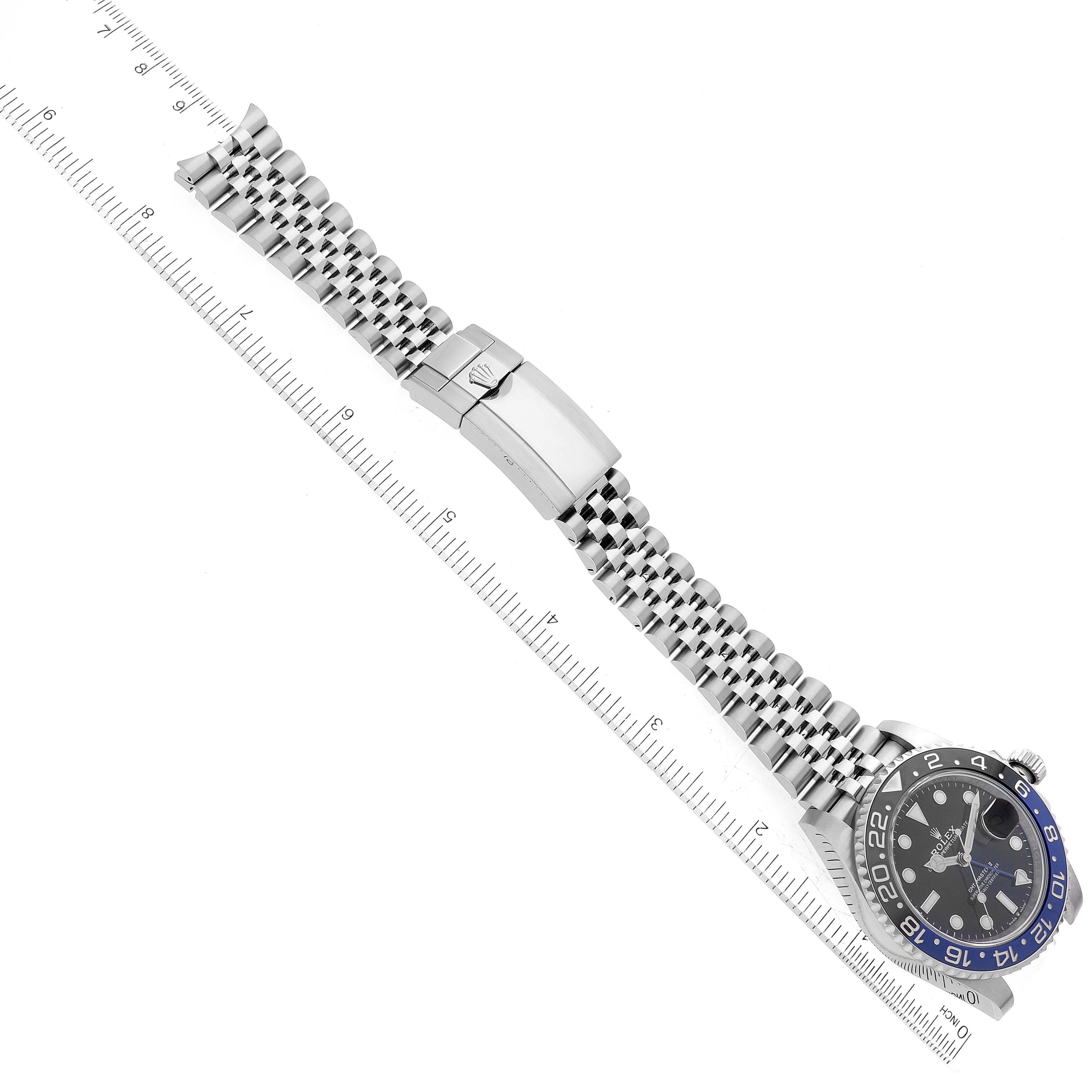 The image shows a top-down view of the Rolex GMT-Master 126710BLNR Men
s Stainless Steel Black Dial 126710BLNR Men
s Stainless Steel Black Dial watch, displaying the dial, bezel, and the bracelet with its clasp.