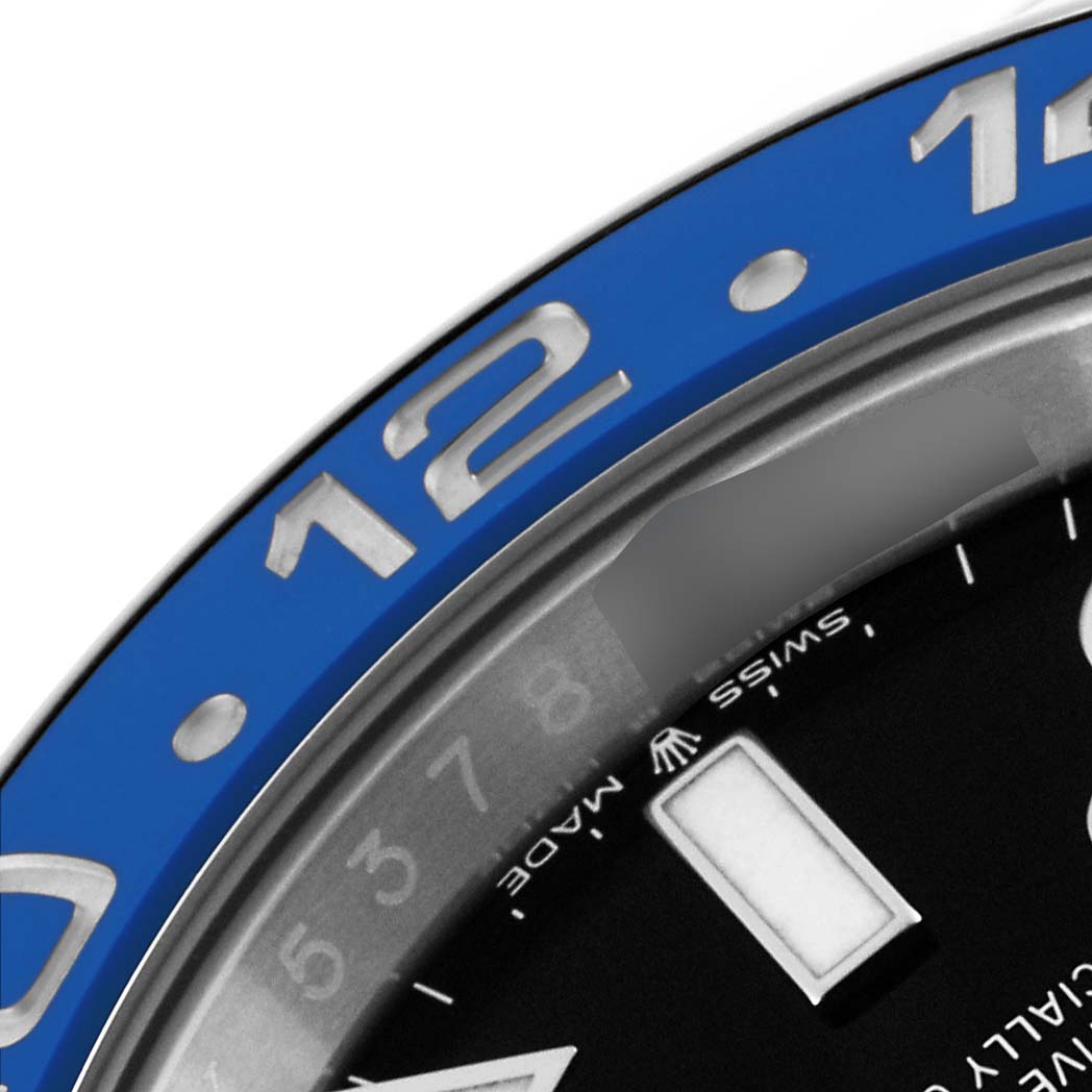 This image shows a close-up of the bezel and part of the dial of a Rolex GMT-Master 126710BLNR Men
s Stainless Steel Black Dial 126710BLNR Men
s Stainless Steel Black Dial watch.