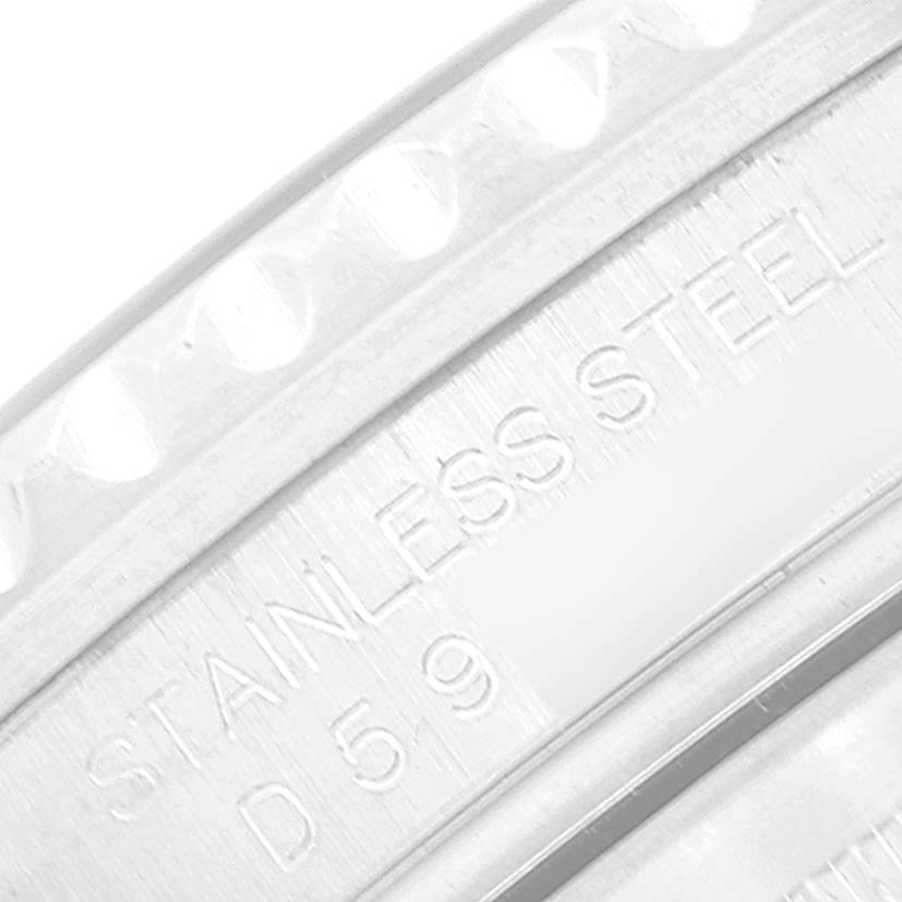 A close-up of the stainless steel bezel of the Rolex GMT-Master 16710 Men's Stainless Steel Black Dial 16710 Men's Stainless Steel Black Dial, showing the engraved details.