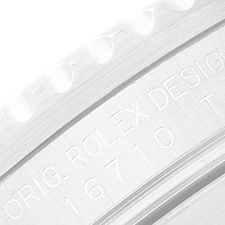 This close-up image highlights the bezel and engraved inner ring of a Rolex GMT-Master 16710 Men's Stainless Steel Black Dial 16710 Men's Stainless Steel Black Dial model.