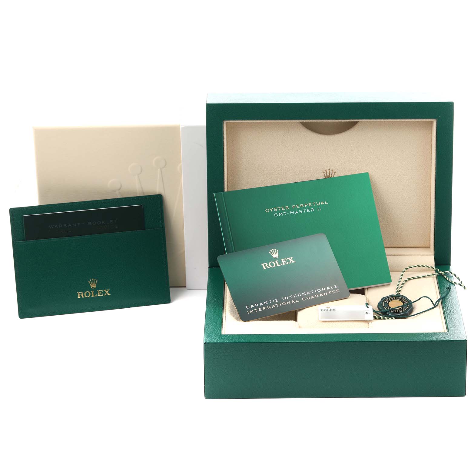 The image shows the packaging and accessories for a Rolex GMT-Master 126710GRNR Men's Stainless Steel Black Dial 126710GRNR Men's Stainless Steel Black Dial, including the box, warranty booklet, and guarantee card.