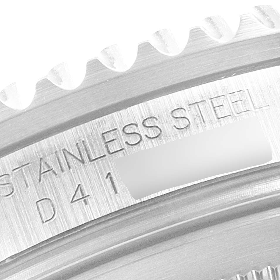 The image shows a close-up of the case back engraving of a Rolex GMT-Master 16710 Men's Stainless Steel Black Dial 16710 Men's Stainless Steel Black Dial watch, highlighting the "STAINLESS STEEL" text.