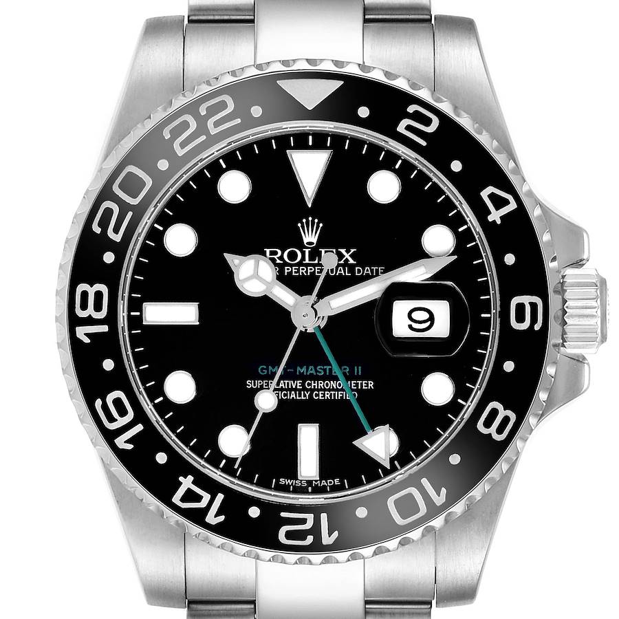 The Rolex GMT-Master is shown from a front angle, displaying the bezel, dial, hands, and date window.