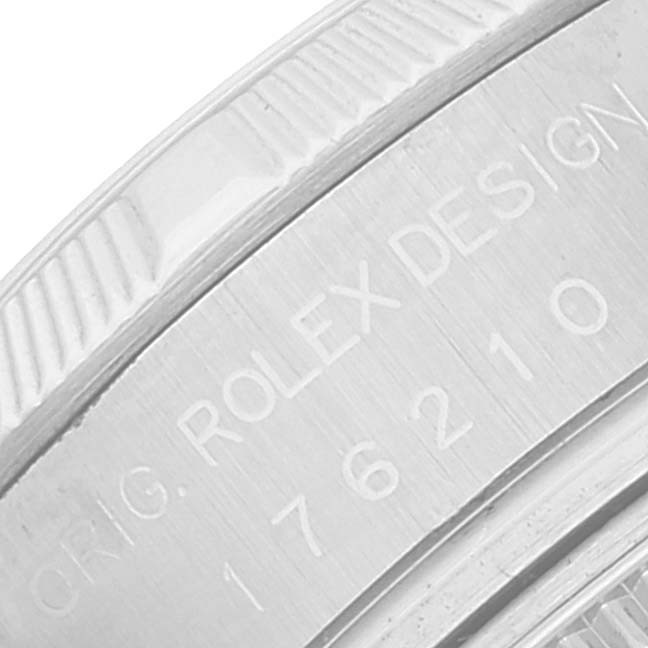 The image shows a close-up of the engraved case back of a Rolex Oyster Perpetual 176210 Women's Stainless Steel Black Dial 176210 Women's Stainless Steel Black Dial watch with the model number and "ROLEX DESIGN" text visible.