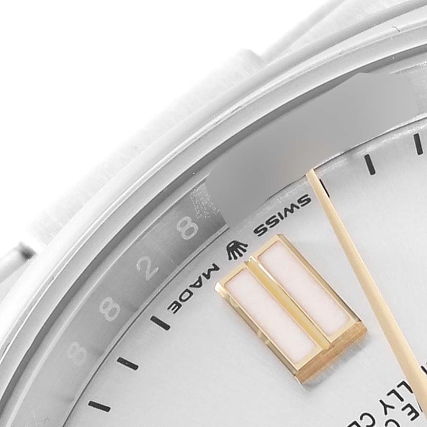This image shows a close-up of the face and edge of a Rolex Oyster Perpetual 124300 Men's Stainless Steel Silver Dial 124300 Men's Stainless Steel Silver Dial watch, focusing on the dial and hour markers.