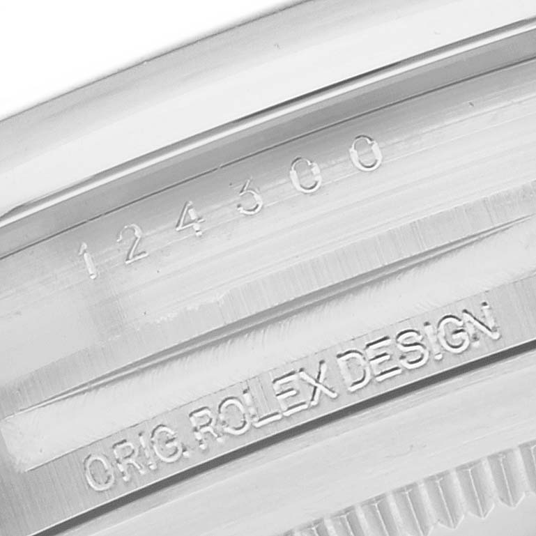 This close-up image shows the engraved model number and "ORIG. ROLEX DESIGN" text on the caseback ring of a Rolex Oyster Perpetual 124300 Men's Stainless Steel Silver Dial 124300 Men's Stainless Steel Silver Dial watch.