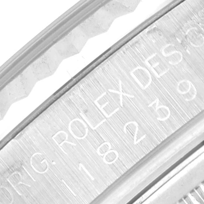 The image shows a close-up of the inner edge engraving on a Rolex President 118239 Men's White Gold Silver Dial 118239 Men's White Gold Silver Dial watch case.