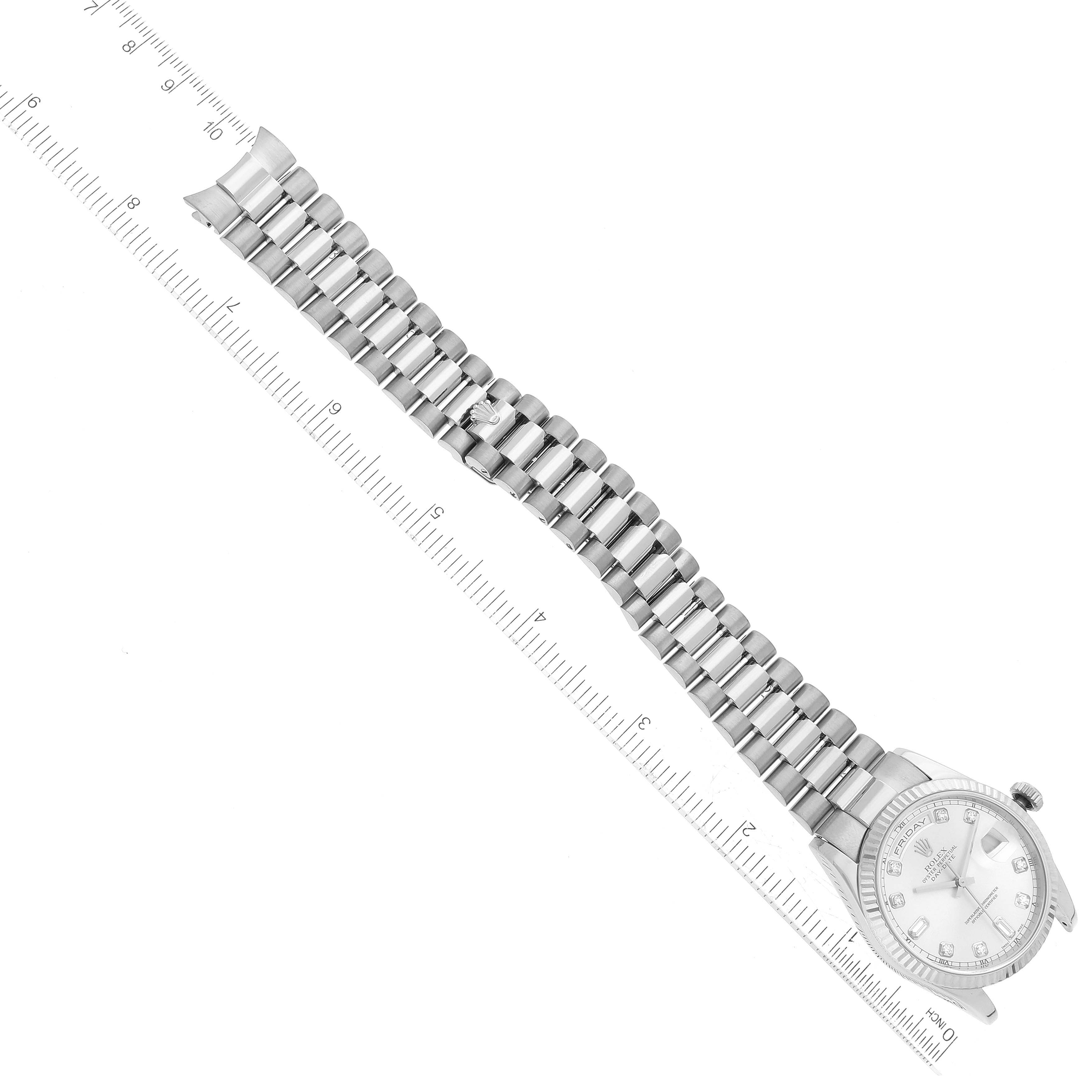 The image shows the Rolex President 118239 Men's White Gold Silver Dial 118239 Men's White Gold Silver Dial watch model laid flat with a ruler, displaying its band and part of the dial from an overhead angle.